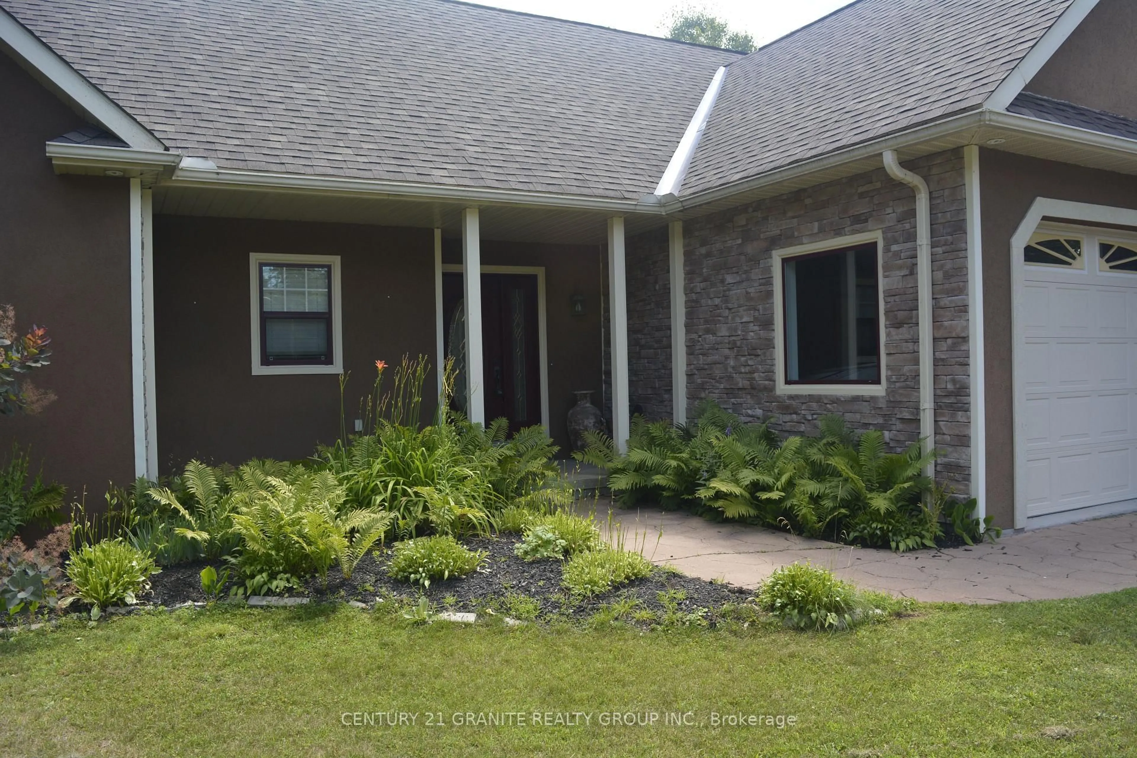 Home with brick exterior material, street for 52 Nicklaus Dr, Bancroft Ontario K0L 1C0