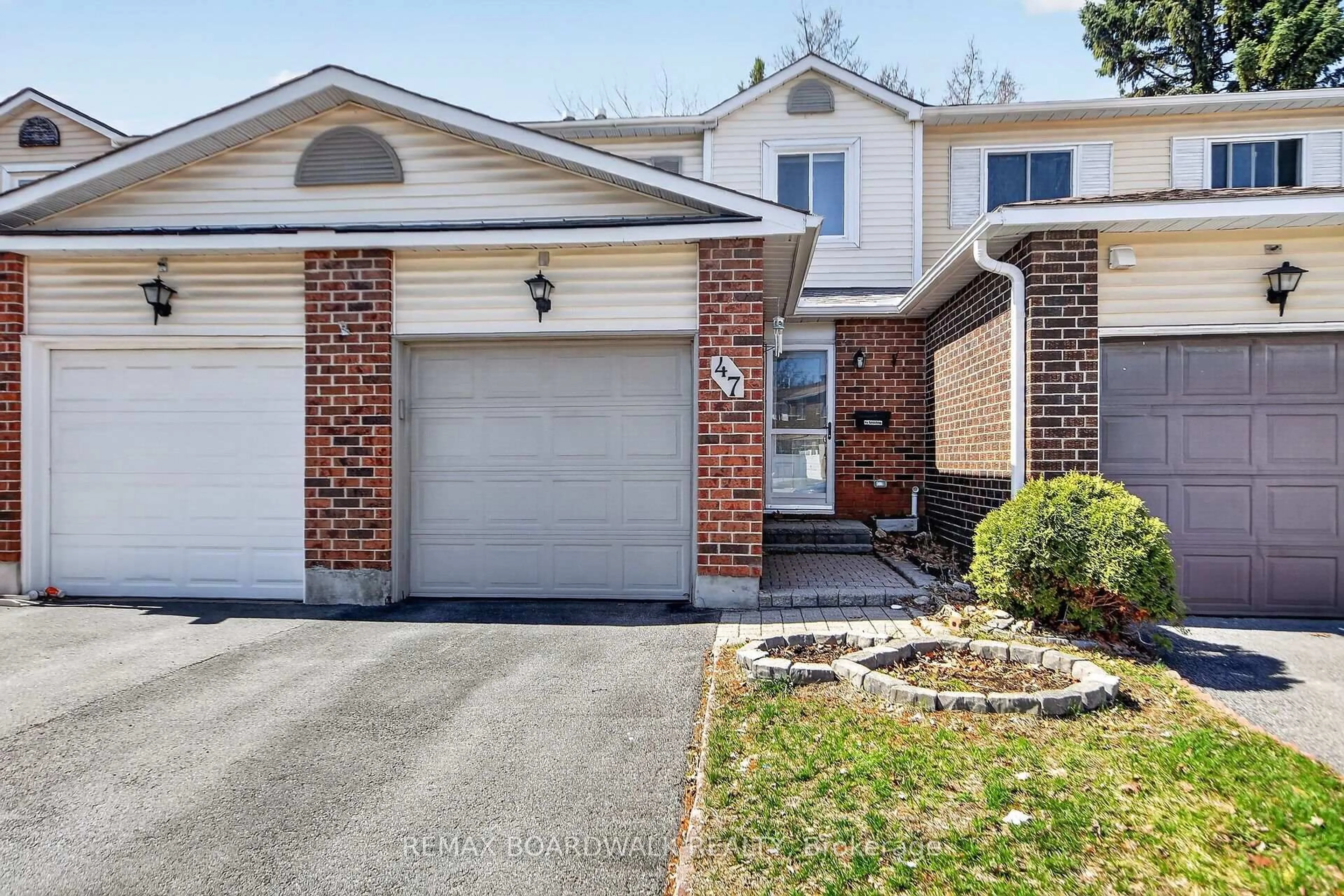 Home with brick exterior material, street for 47 Sunridge Lane #10, Ottawa Ontario K2J 2N9
