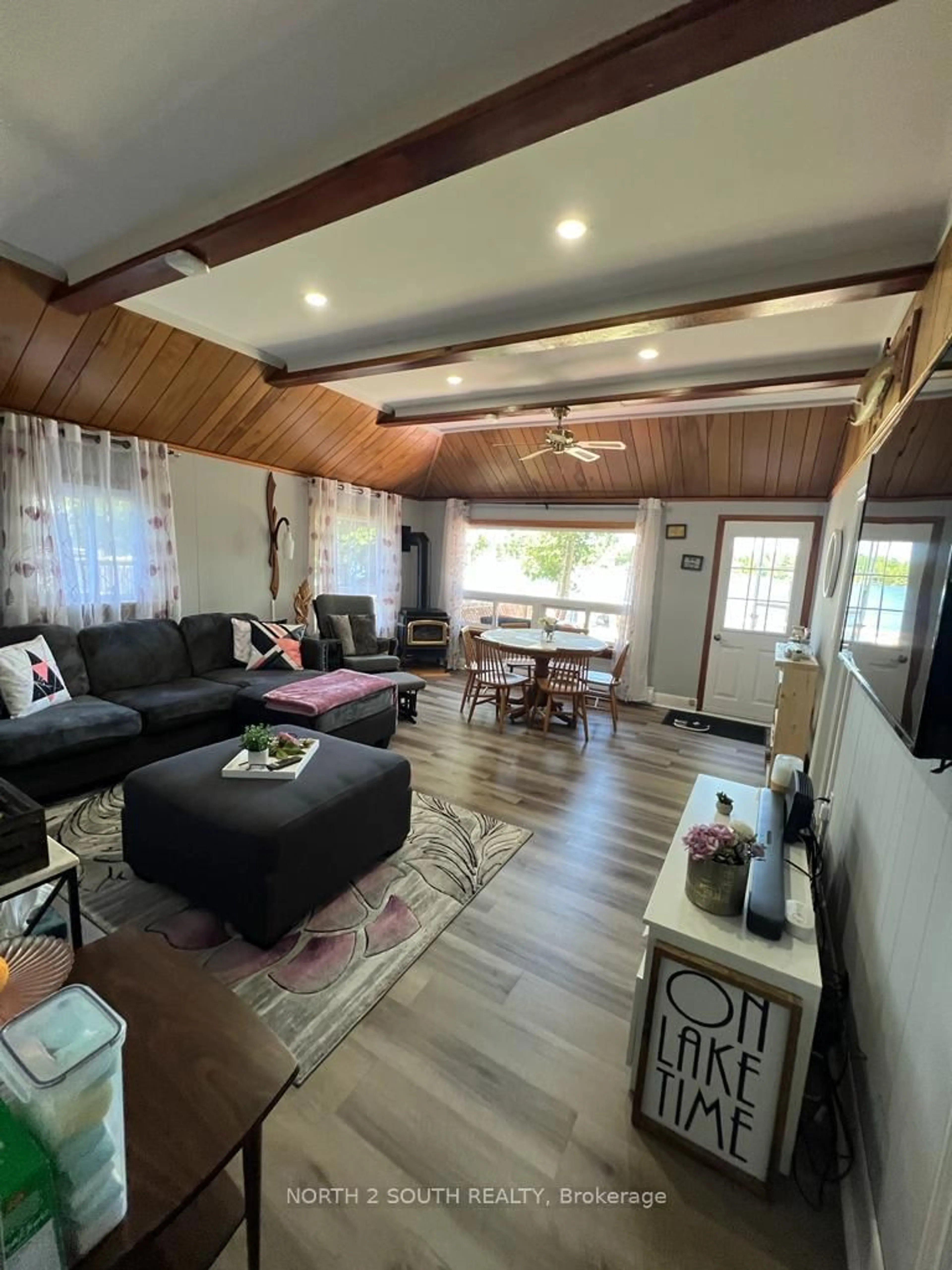 Living room with furniture, wood/laminate floor for 55 Paradise Rd, Kawartha Lakes Ontario K0M 1B0