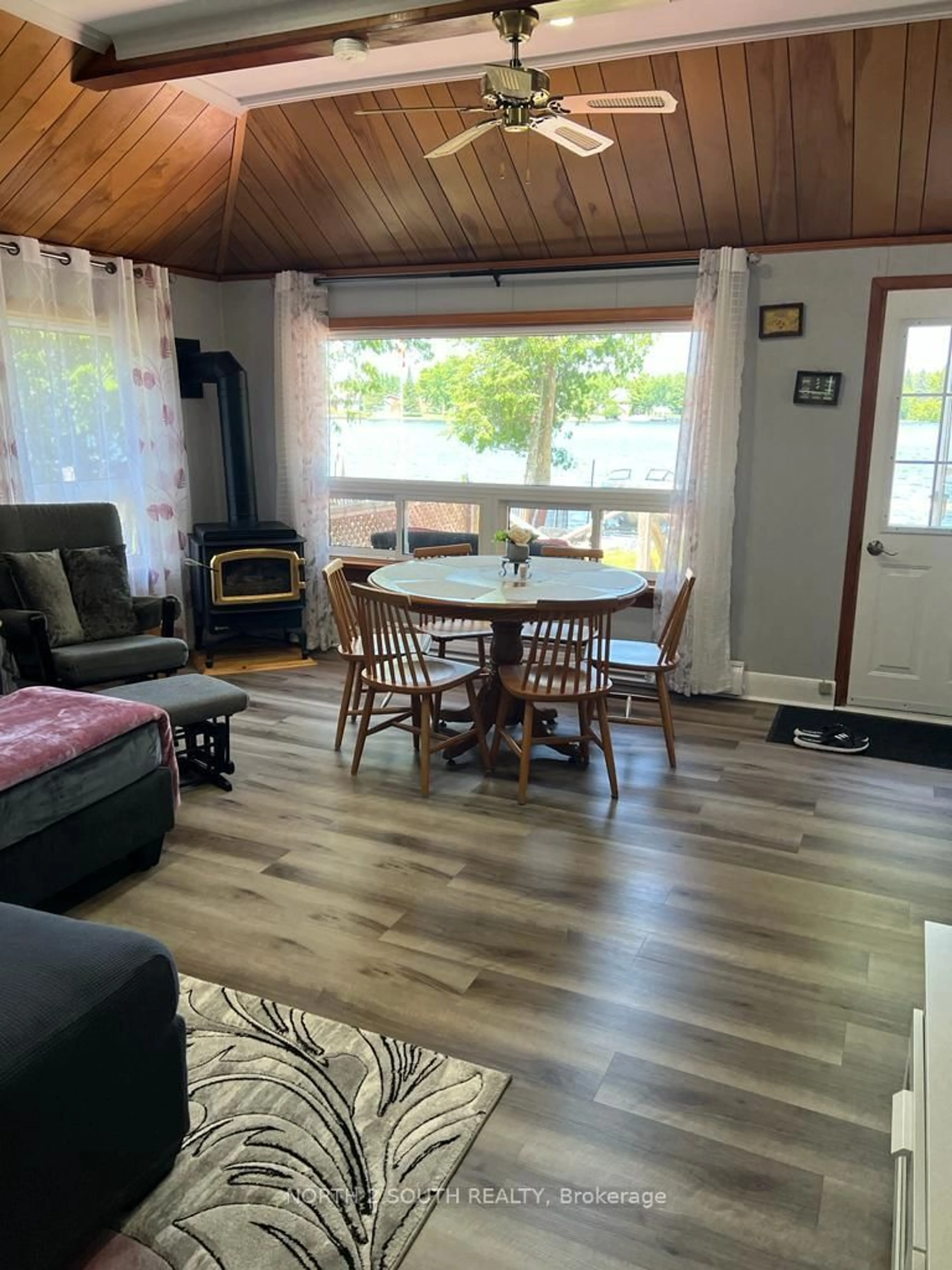 Living room with furniture, wood/laminate floor for 55 Paradise Rd, Kawartha Lakes Ontario K0M 1B0