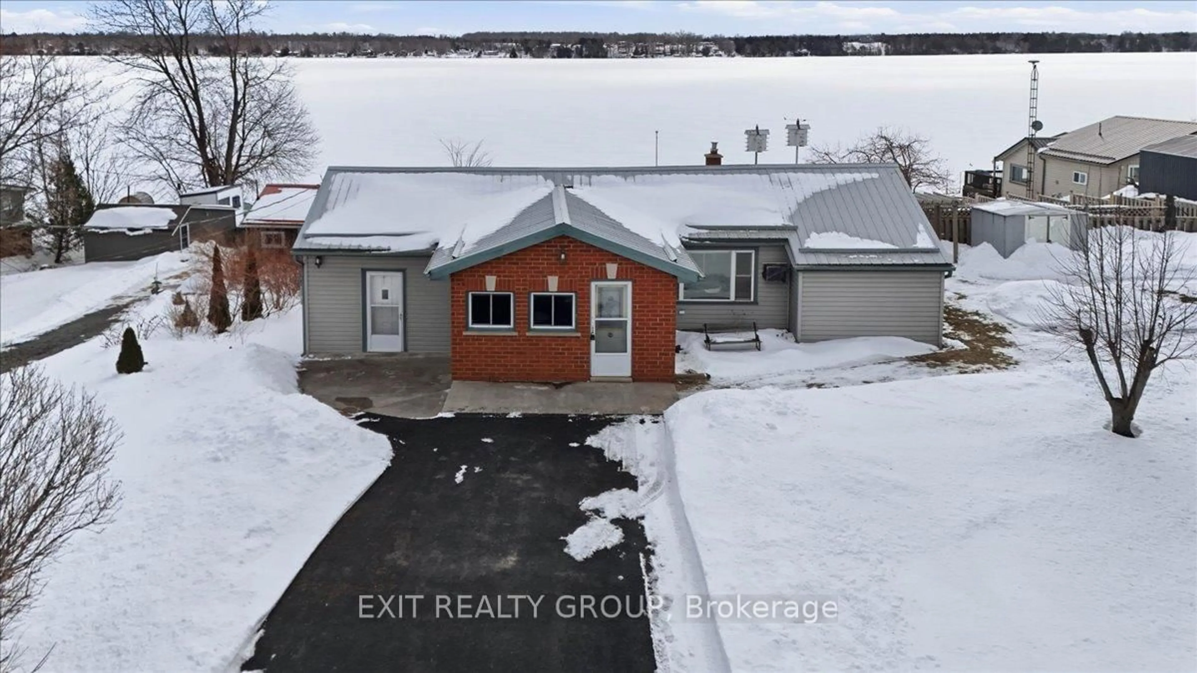 A pic from outside/outdoor area/front of a property/back of a property/a pic from drone, street for 1083 Lakeside Dr, Prince Edward County Ontario K0K 1T0