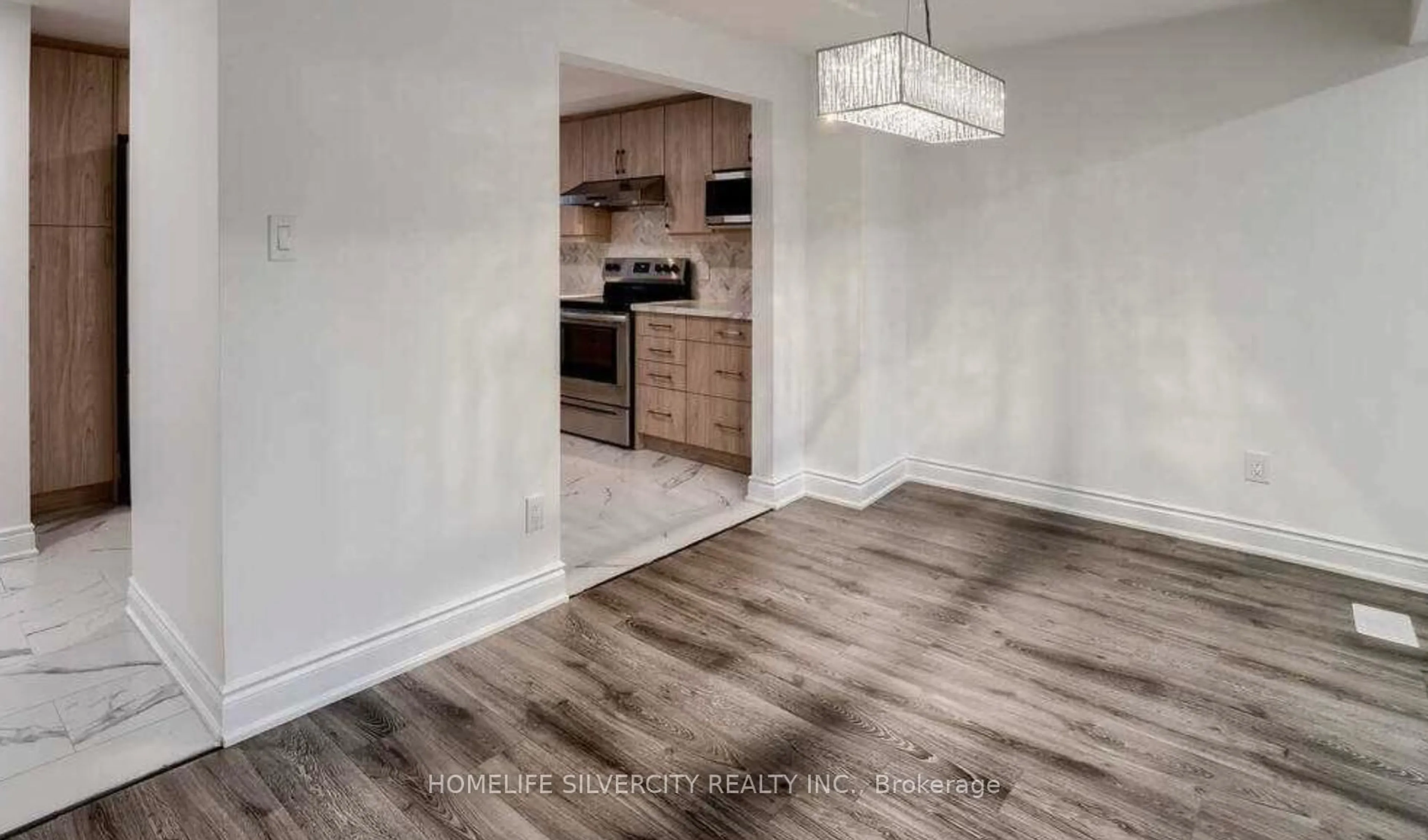 Open concept kitchen, wood/laminate floor for 731 Elgin St, Cambridge Ontario N1R 7W5