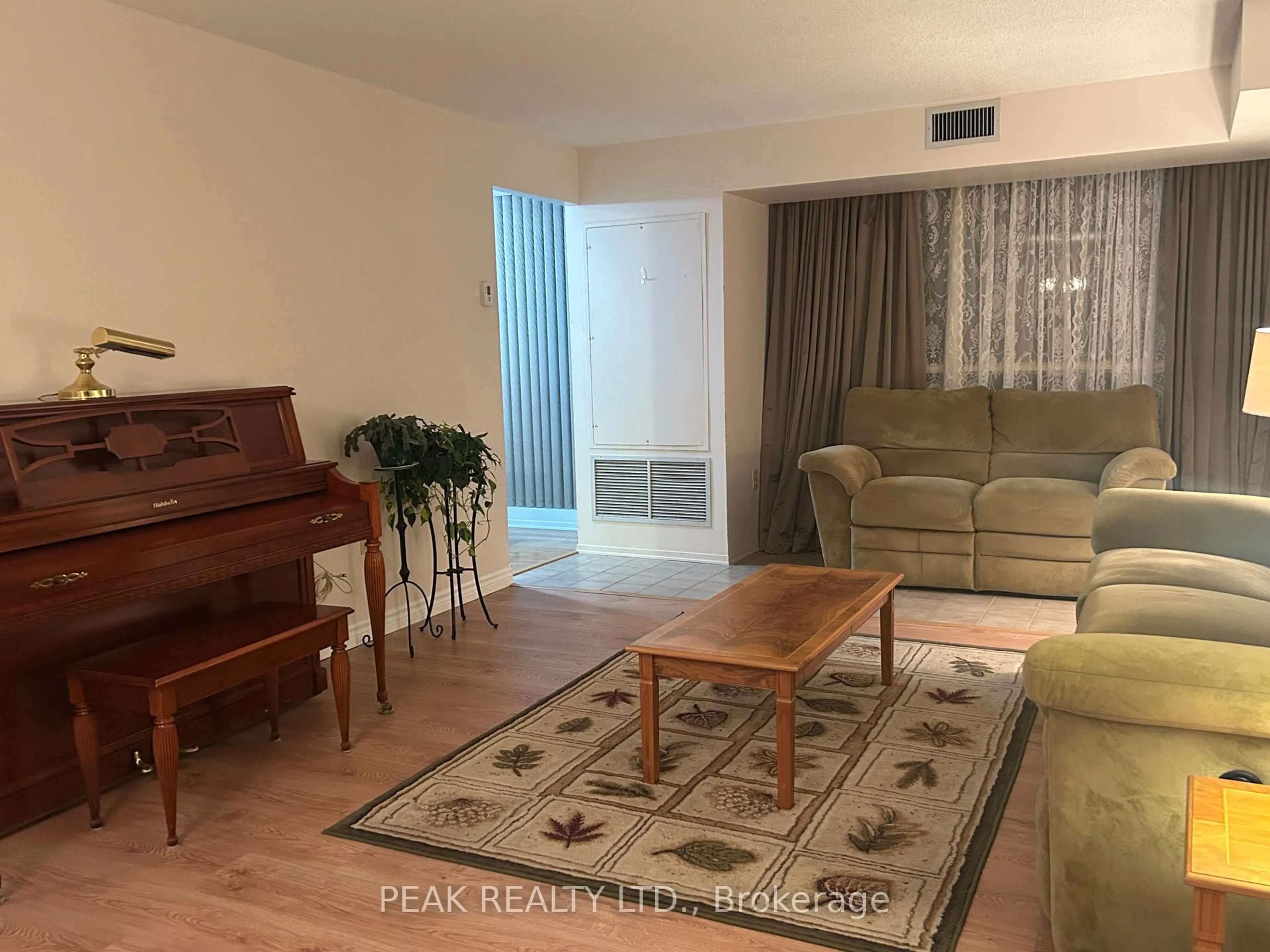 Living room with furniture, wood/laminate floor for 55 Blue Springs Dr #202, Waterloo Ontario N2J 4T3