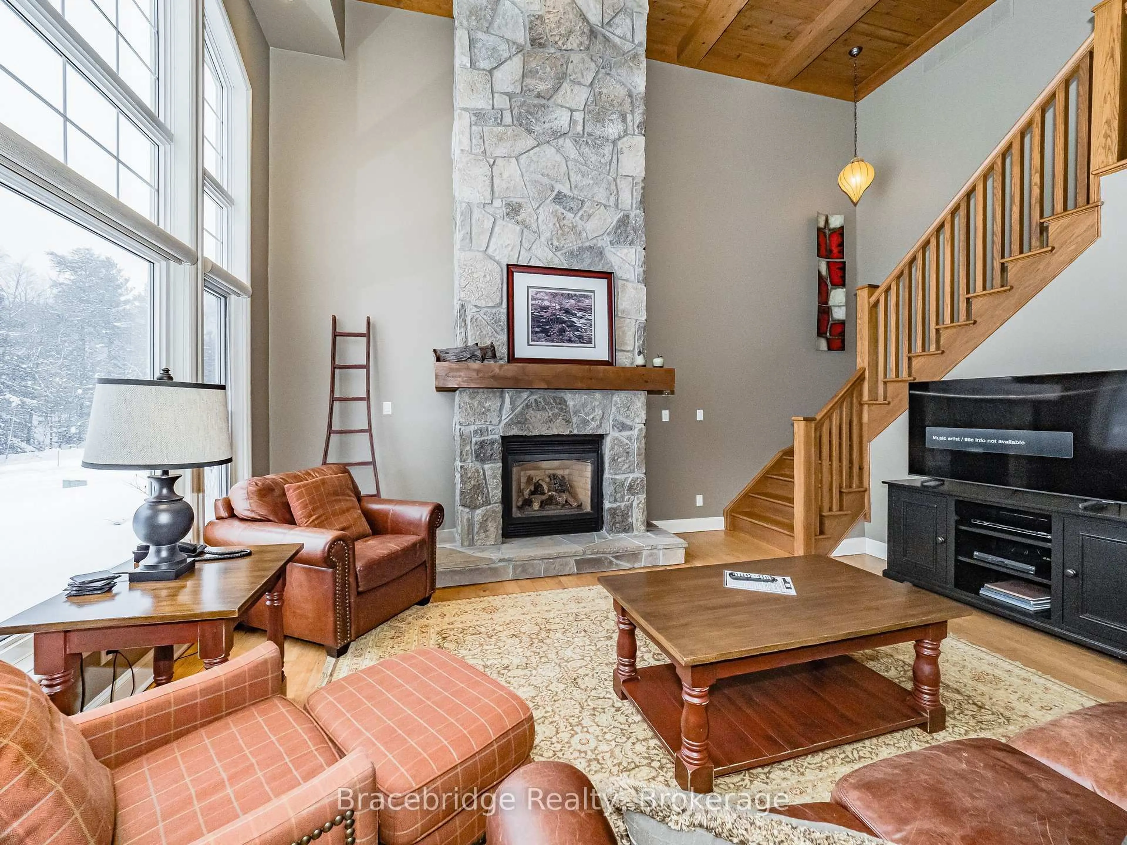 Living room with furniture, unknown for 3876 Muskoka Rd 118 Highway #Sandfield 5 W10, Muskoka Lakes Ontario P0B 1J0