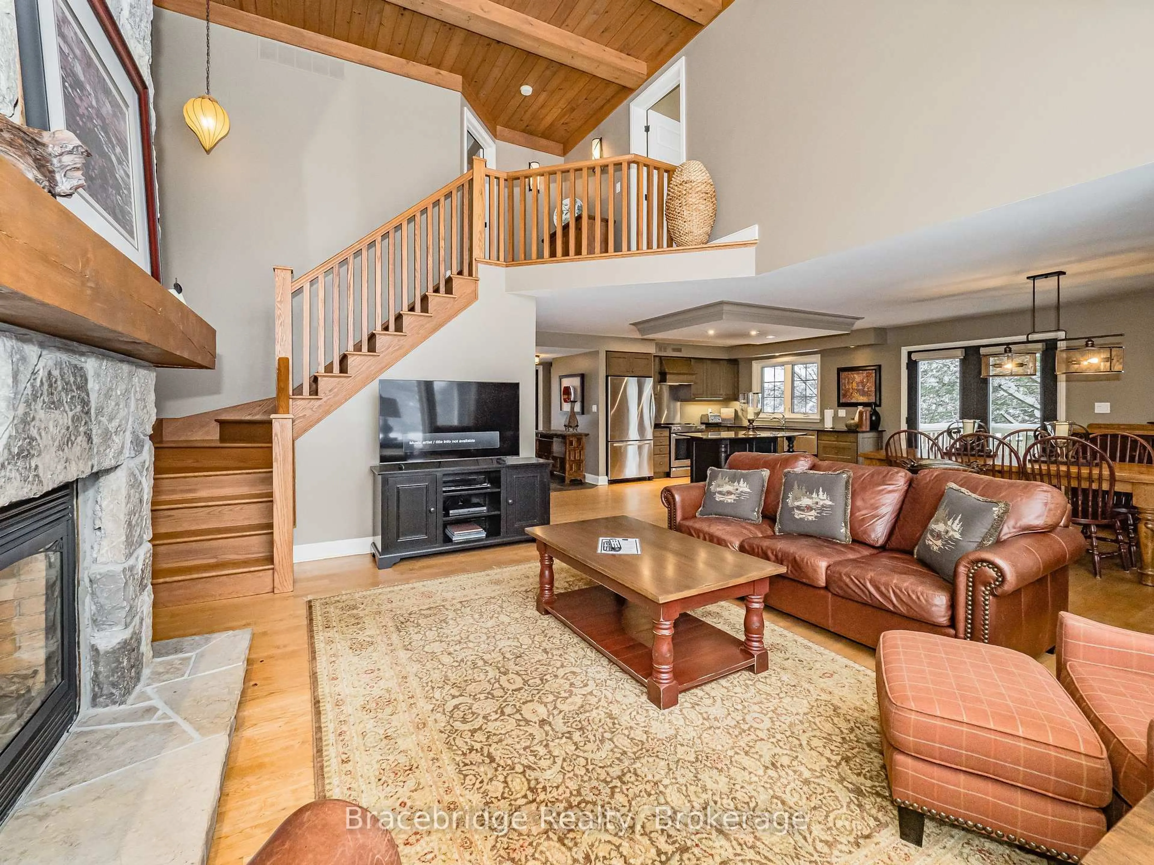 Living room with furniture, unknown for 3876 Muskoka Rd 118 Highway #Sandfield 5 W10, Muskoka Lakes Ontario P0B 1J0