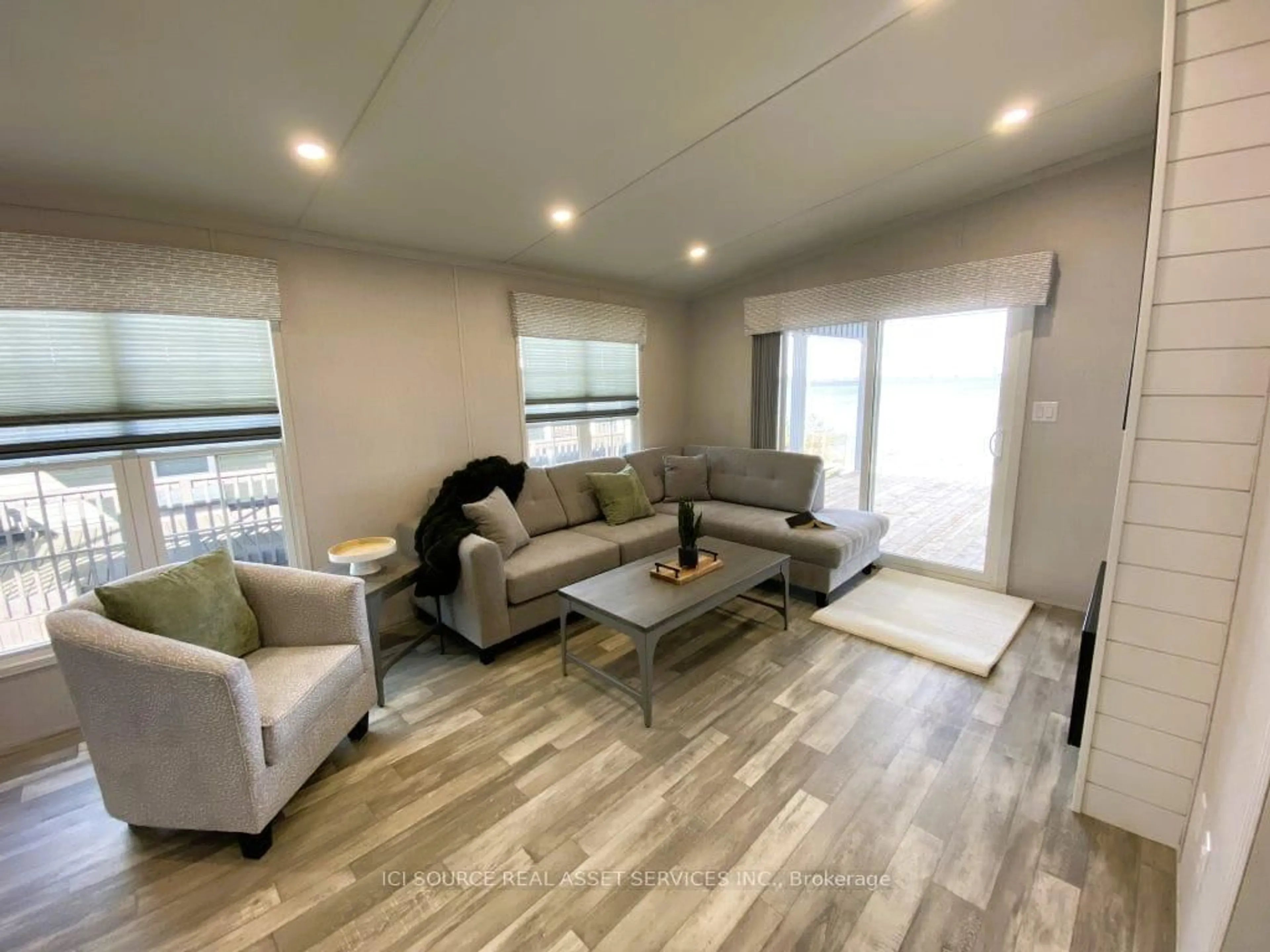 Living room with furniture, wood/laminate floor for 155 McCrearys Beach Rd #LTL306, Perth Ontario K7H 3C8