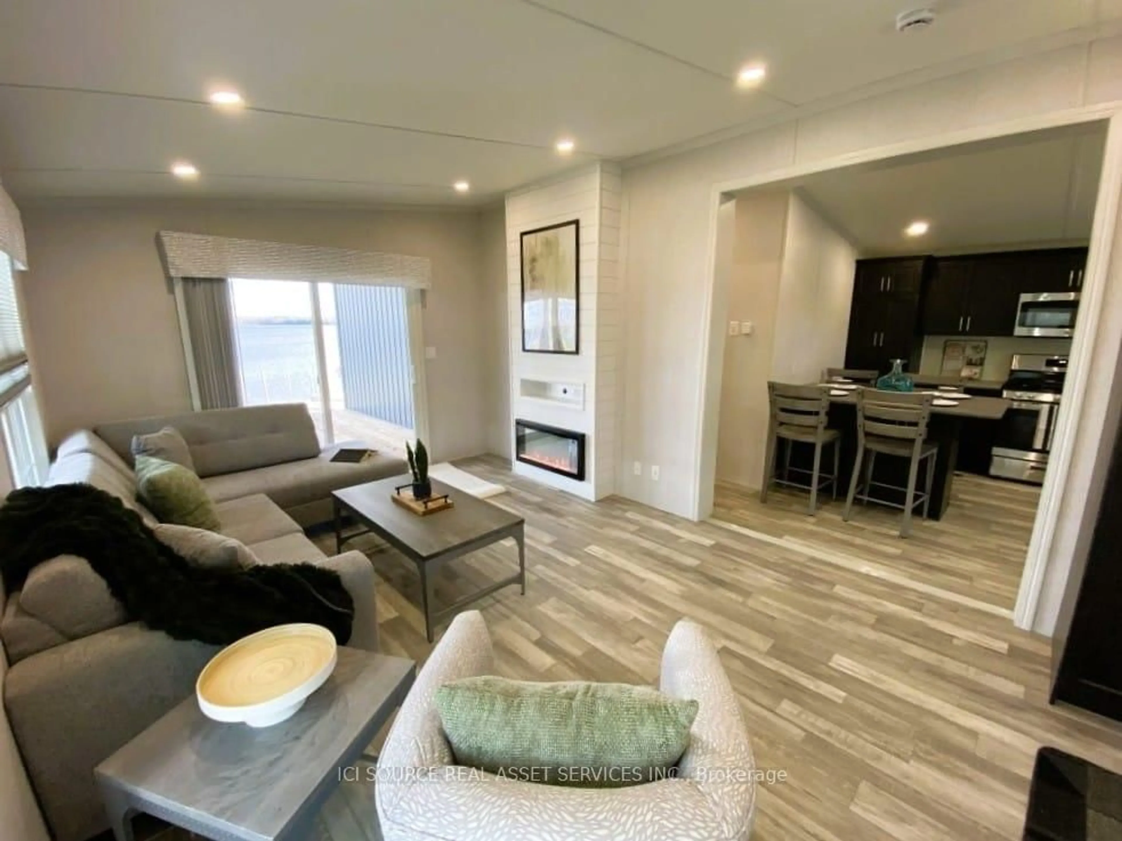 Living room with furniture, wood/laminate floor for 155 McCrearys Beach Rd #LTL306, Perth Ontario K7H 3C8