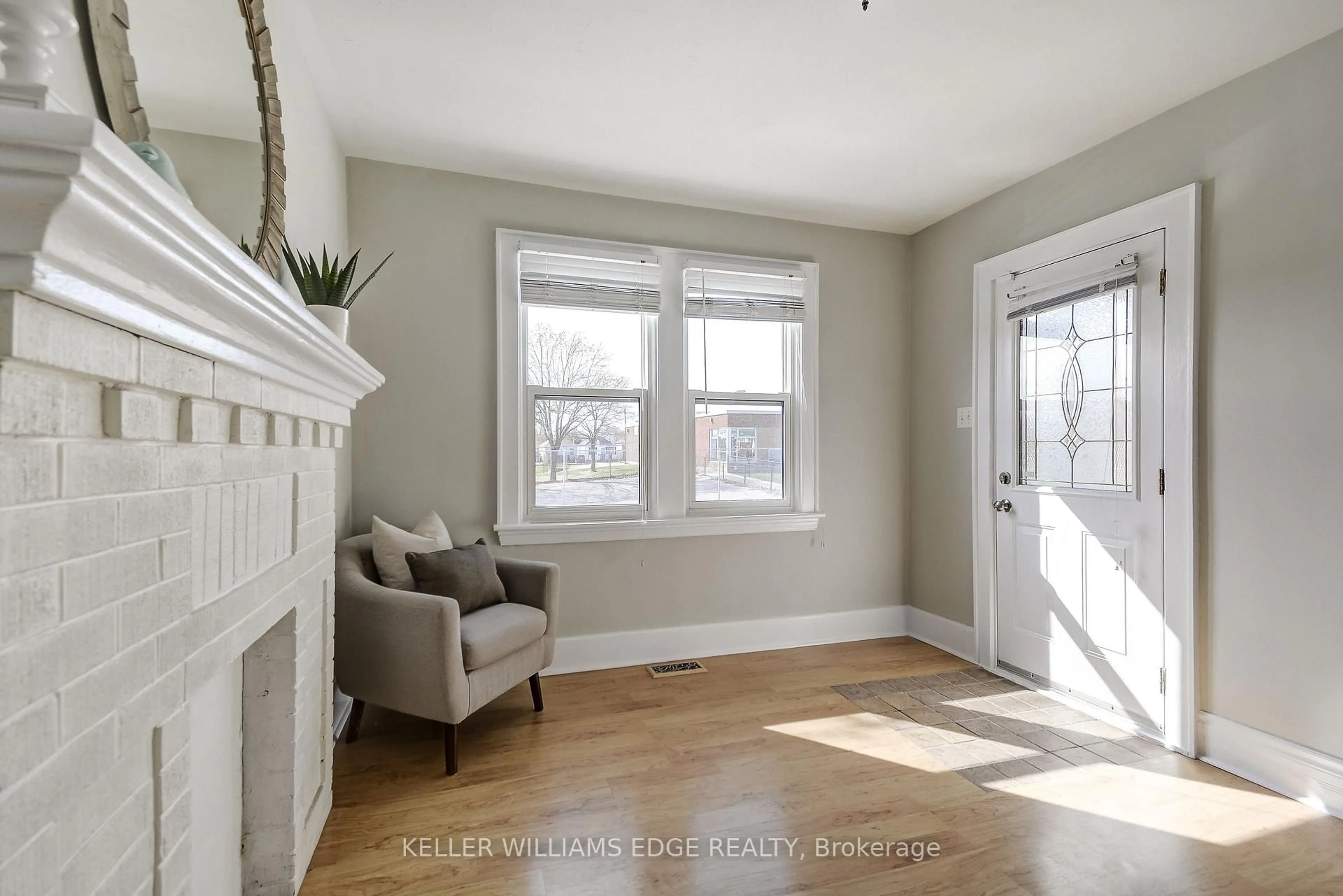 Living room with furniture, wood/laminate floor for 53 East 19th St, Hamilton Ontario L9A 4R9