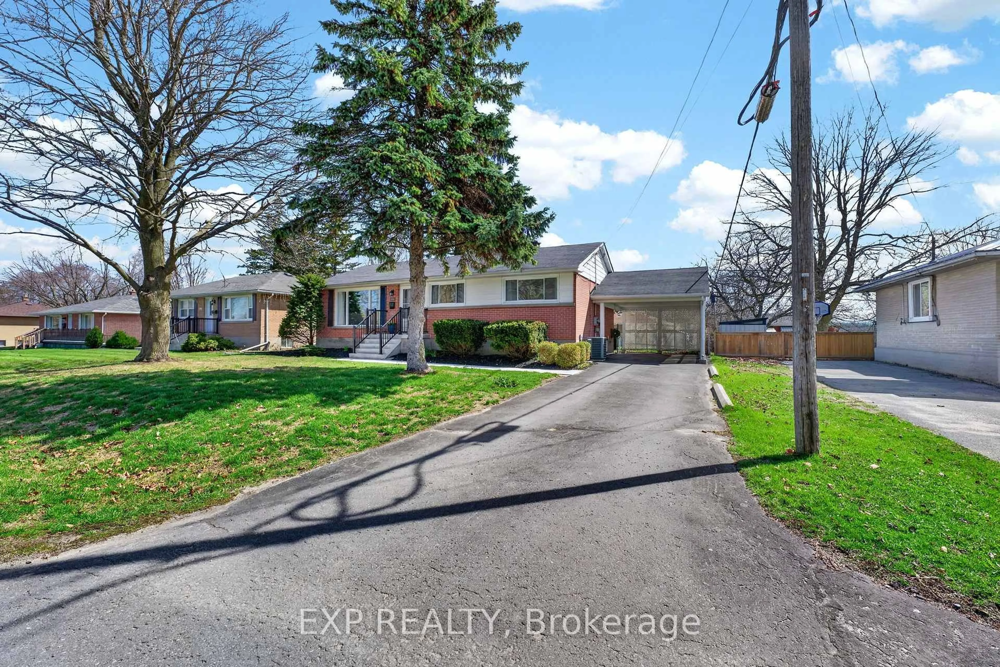 A pic from outside/outdoor area/front of a property/back of a property/a pic from drone, street for 390 Mcewen Dr, Kingston Ontario K7M 3W3