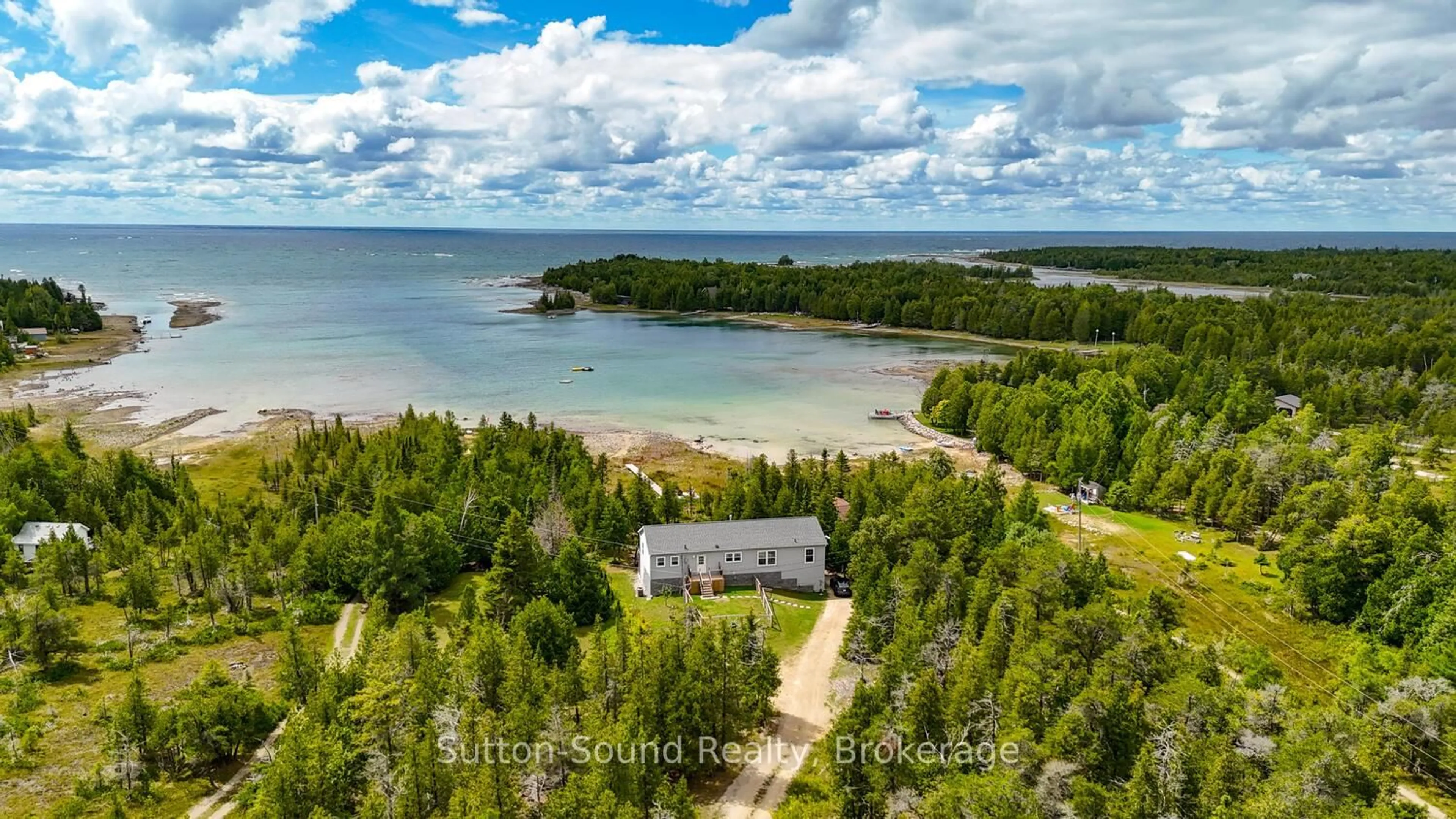 A pic from outside/outdoor area/front of a property/back of a property/a pic from drone, water/lake/river/ocean view for 682 Dorcas Bay Rd, Northern Bruce Peninsula Ontario N0H 2R0