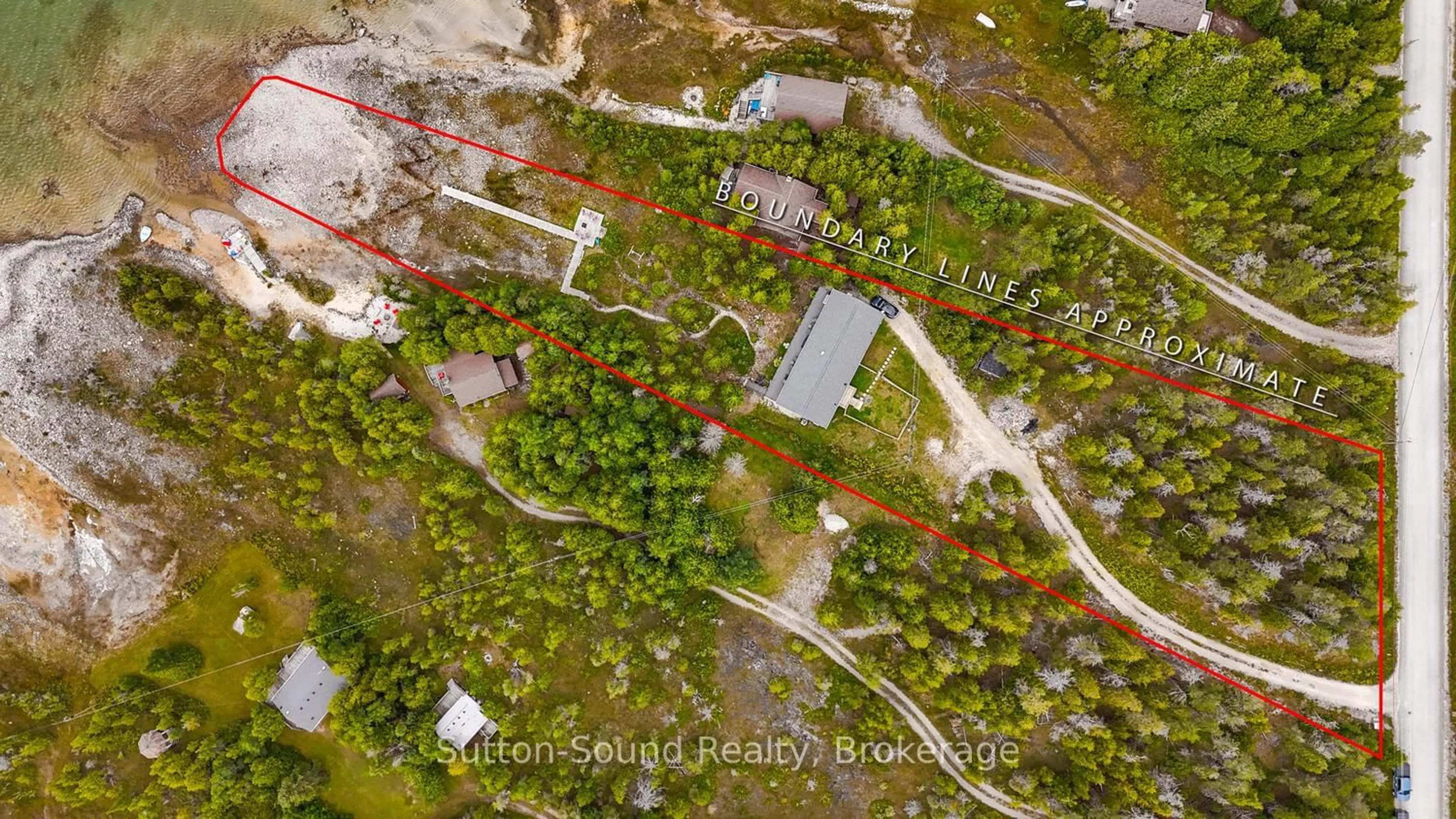 A pic from outside/outdoor area/front of a property/back of a property/a pic from drone, street for 682 Dorcas Bay Rd, Northern Bruce Peninsula Ontario N0H 2R0