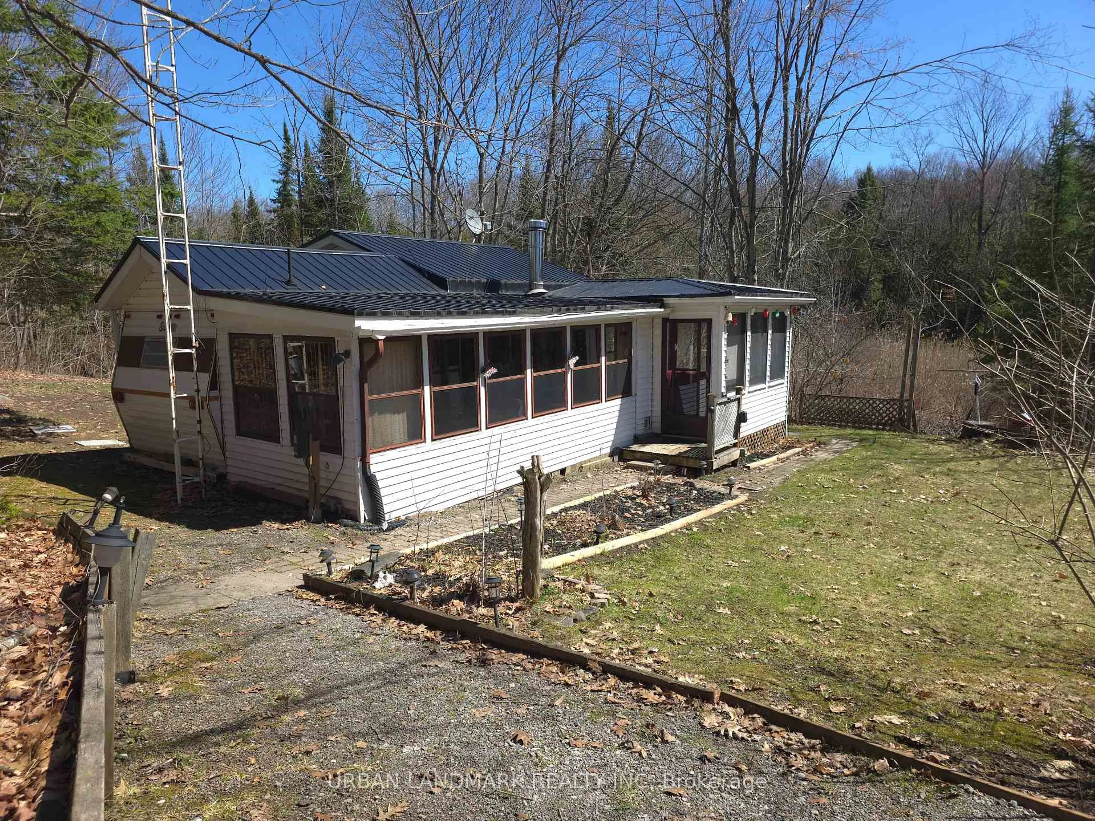 A pic from outside/outdoor area/front of a property/back of a property/a pic from drone, building for 302 Quin Mo Lac Rd #135A, Madoc Ontario K0K 2K0