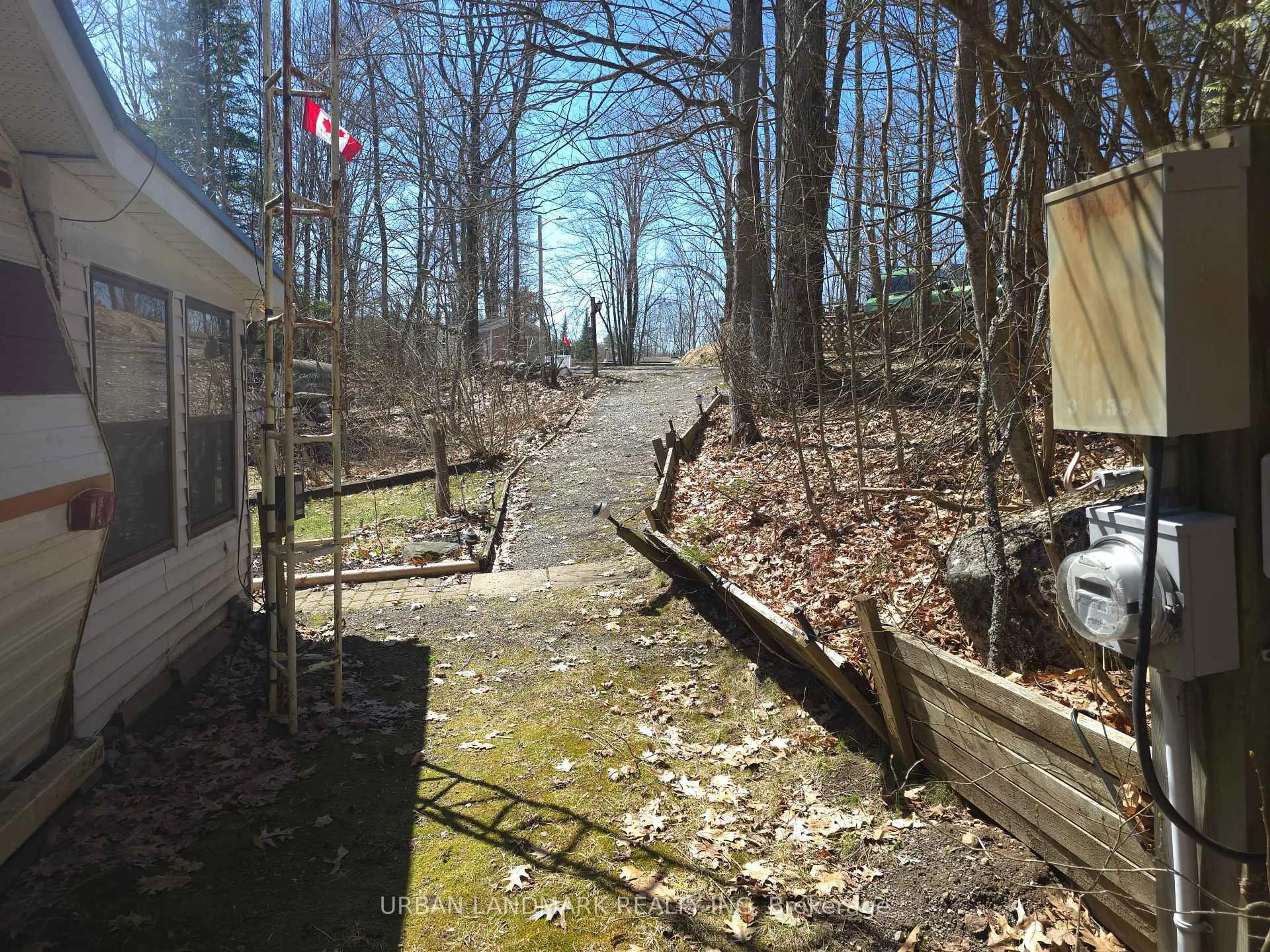 A pic from outside/outdoor area/front of a property/back of a property/a pic from drone, forest/trees view for 302 Quin Mo Lac Rd #135A, Madoc Ontario K0K 2K0