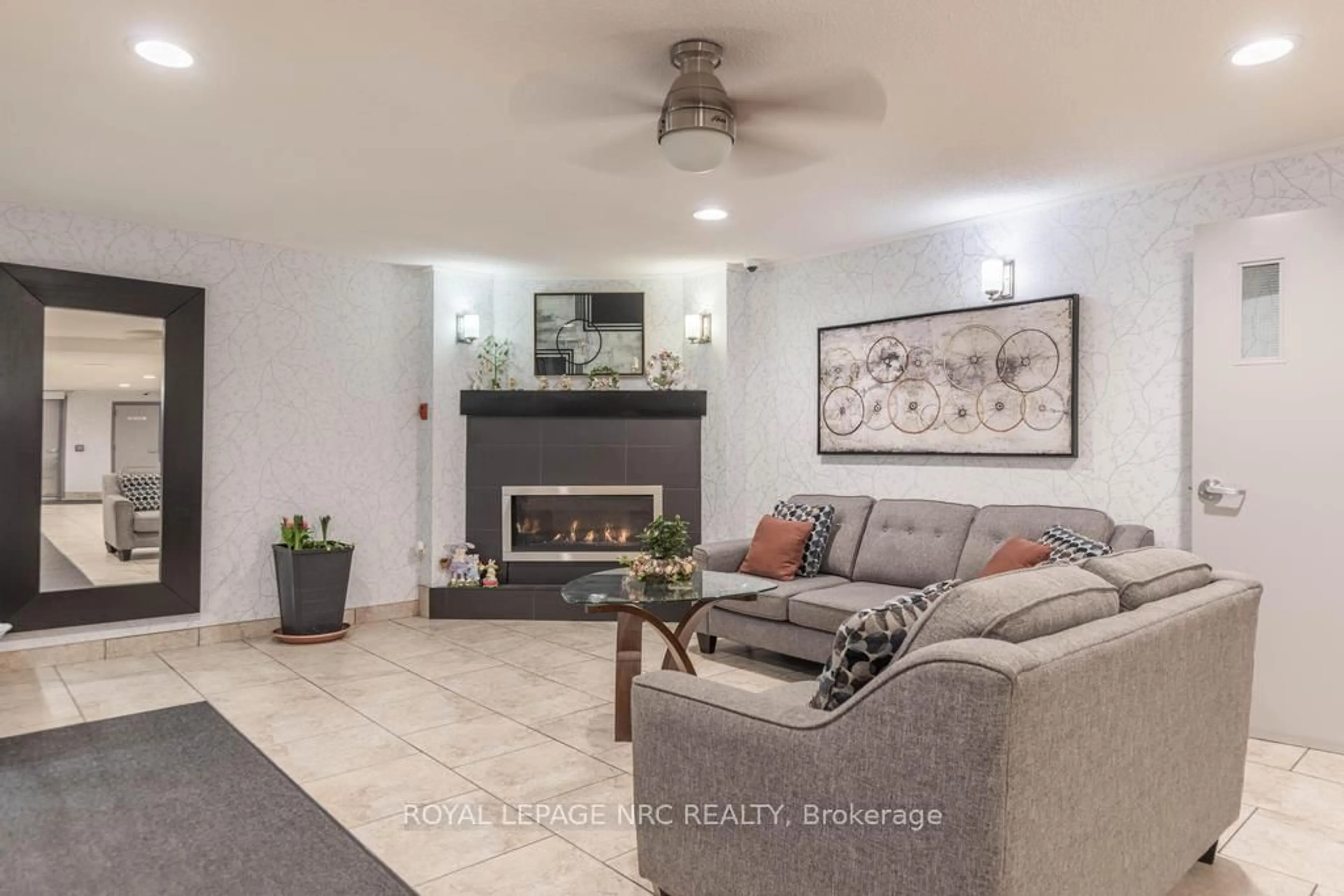 Living room with furniture, ceramic/tile floor for 198 Scott St #410, St. Catharines Ontario L2N 5T3