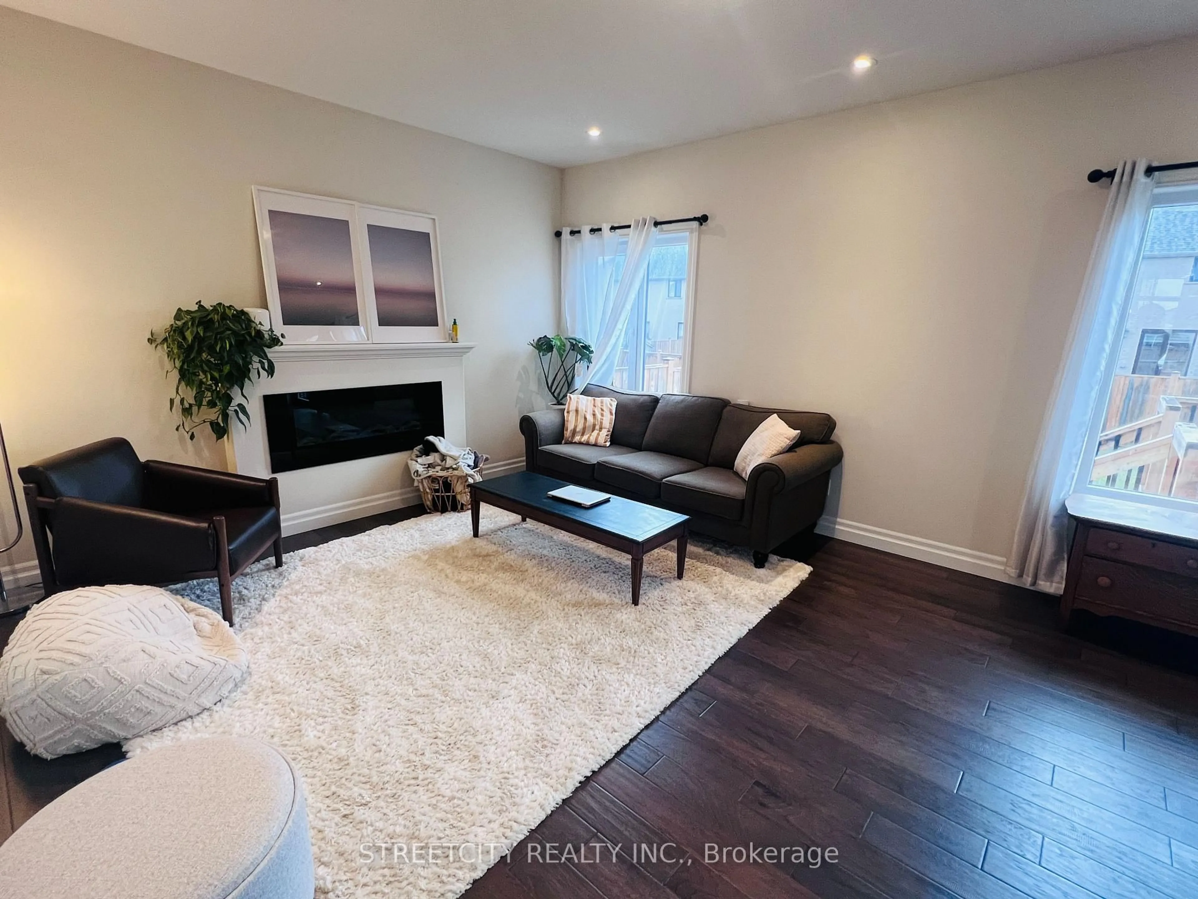 Living room with furniture, wood/laminate floor for 878 Zaifman Circ, London North Ontario N5X 0M9
