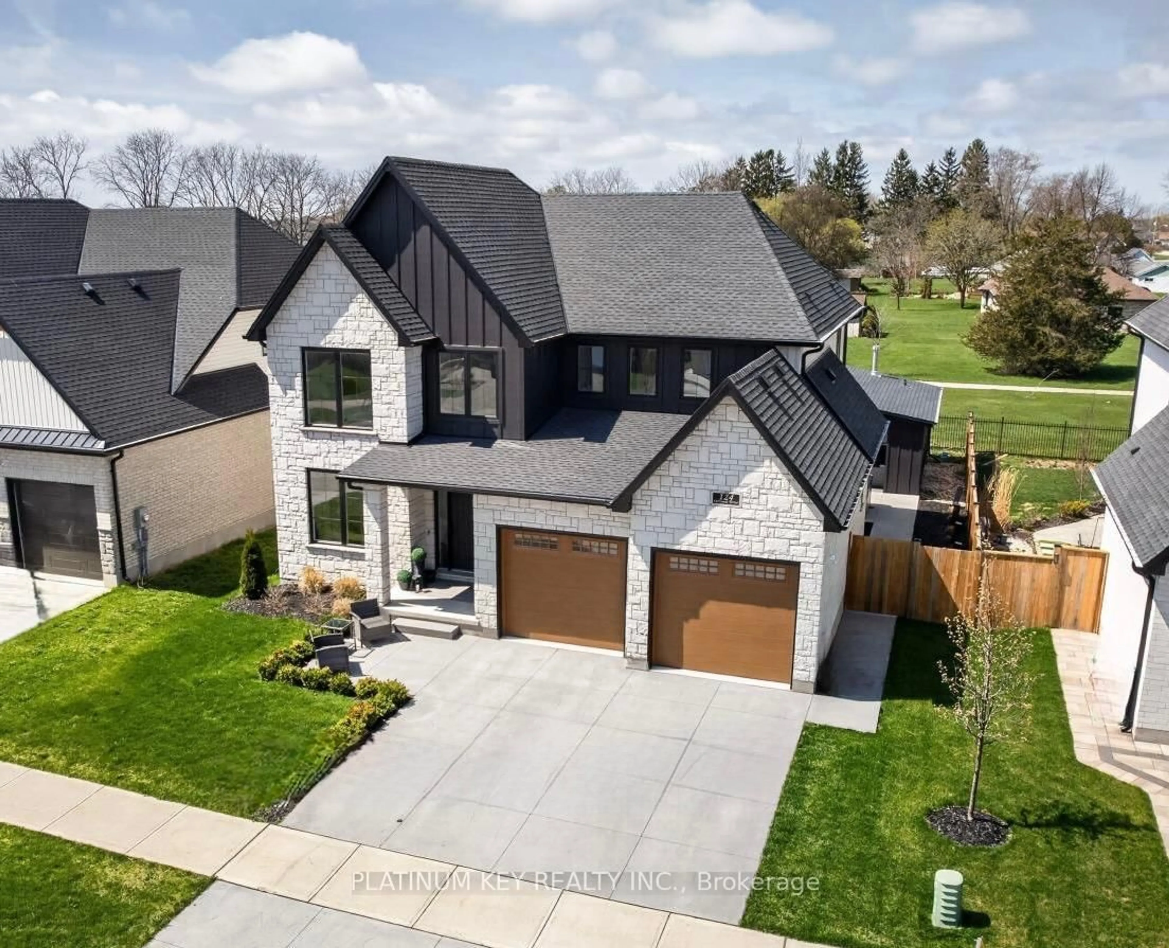 A pic from outside/outdoor area/front of a property/back of a property/a pic from drone, street for 124 OPTIMIST Dr, Southwold Ontario N5P 0G2