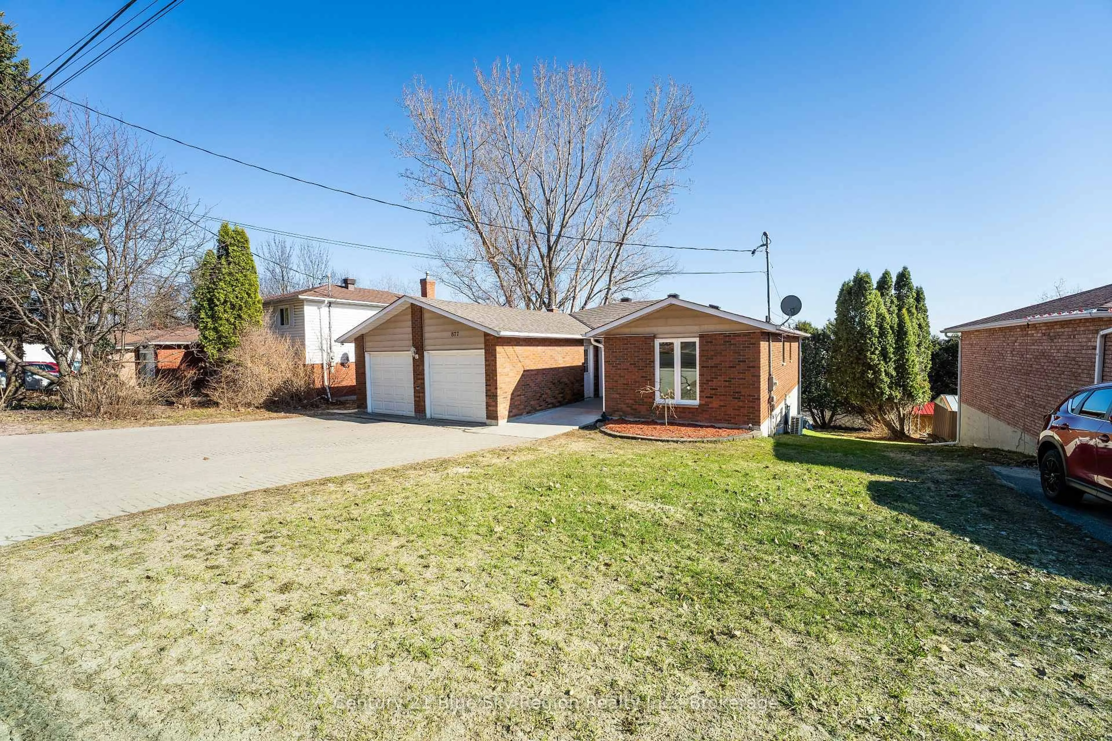 Home with brick exterior material, street for 877 Ski Club Rd, North Bay Ontario P1B 7R5