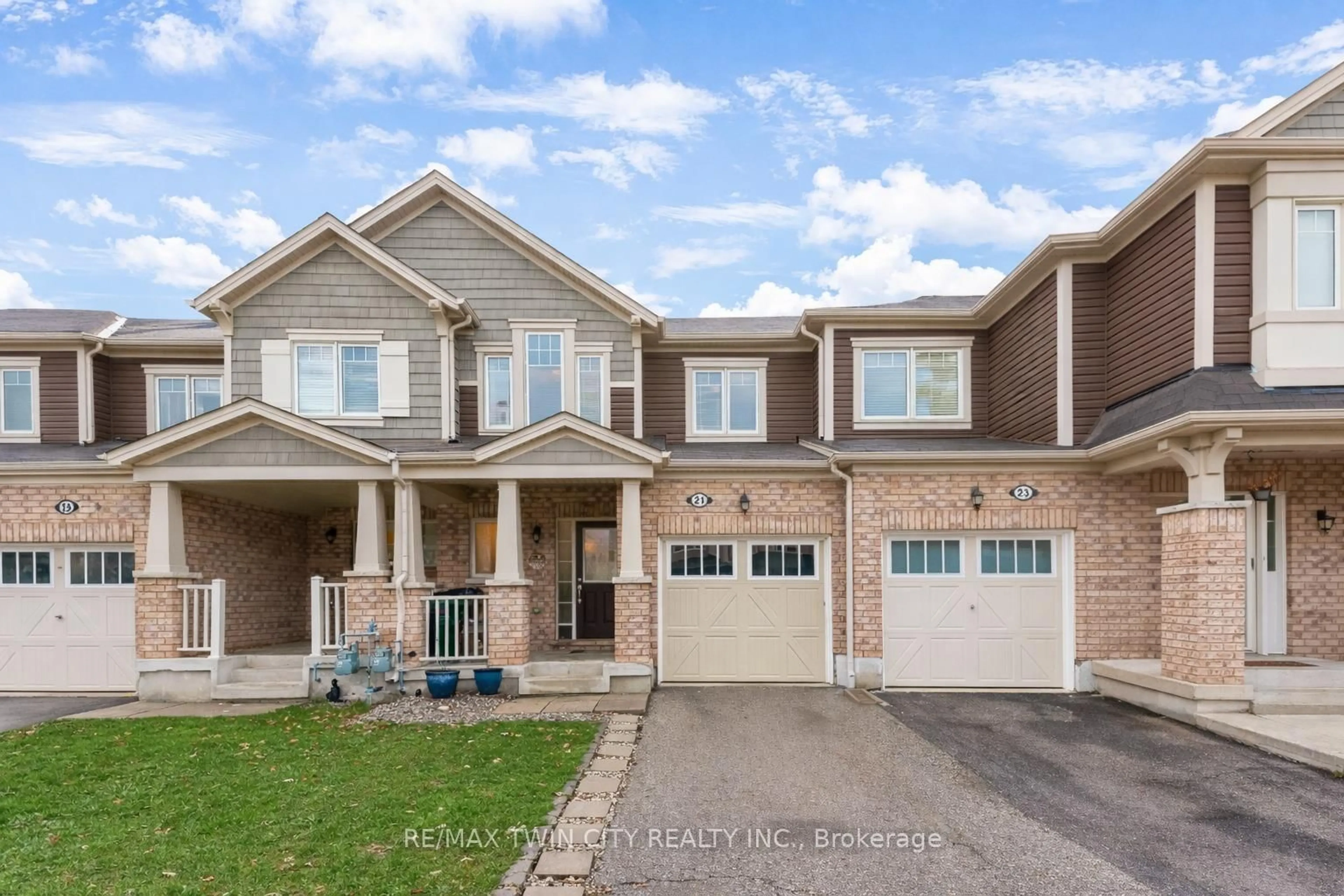 Home with brick exterior material, street for 21 POSTMASTER Dr, Kitchener Ontario N2R 0J2