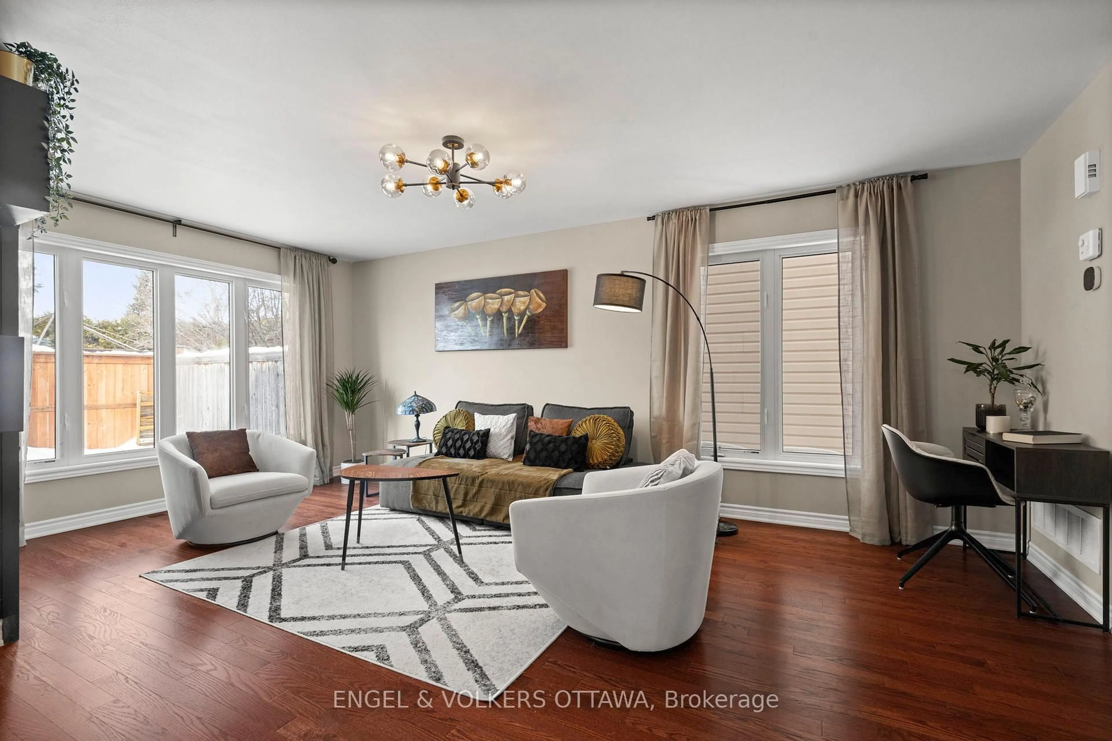 Living room with furniture, wood/laminate floor for 166 Lily Pond St, Ottawa Ontario K2M 0J5