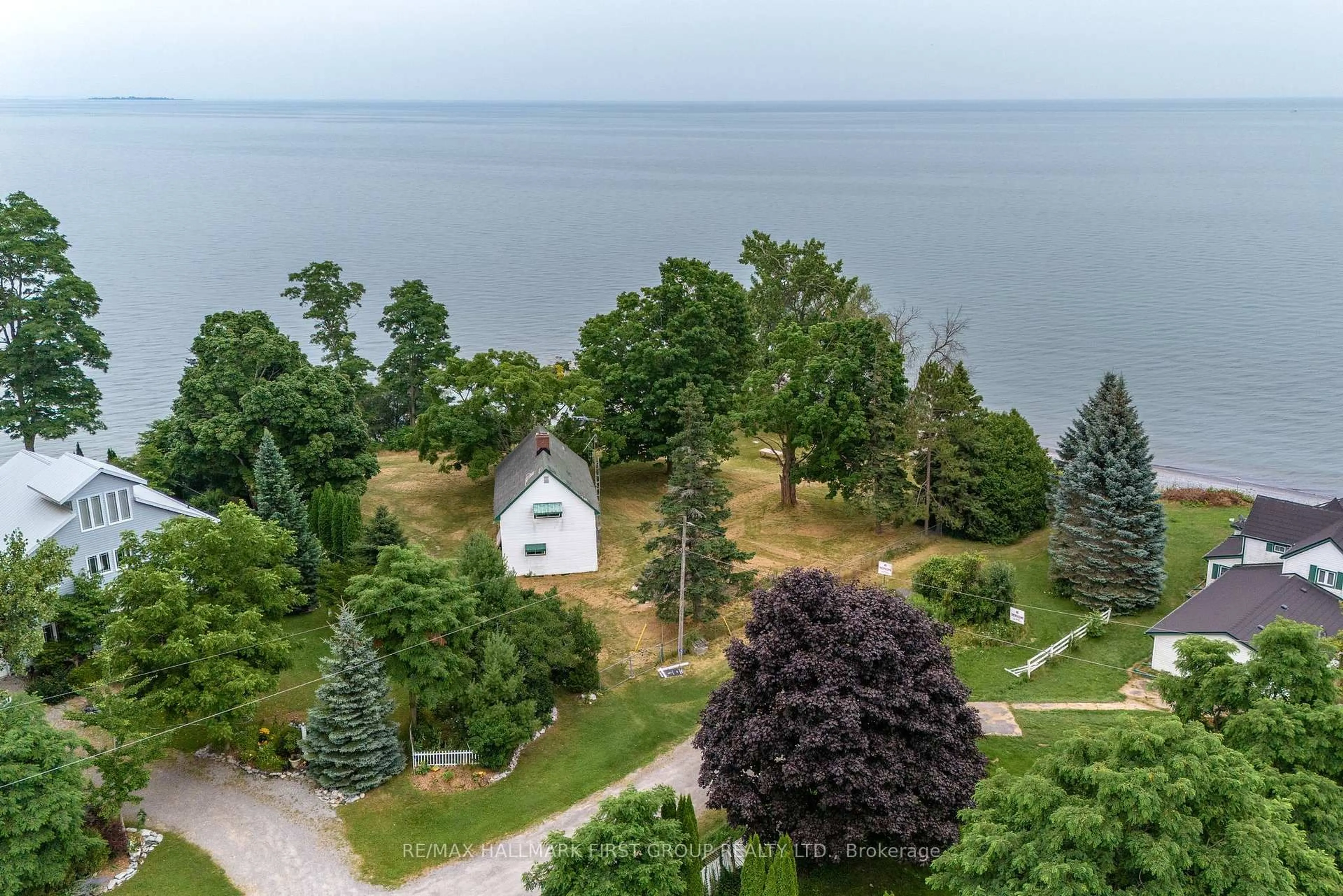 A pic from outside/outdoor area/front of a property/back of a property/a pic from drone, water/lake/river/ocean view for 103 Victoria Beach Rd, Cramahe Ontario K0K 1S0