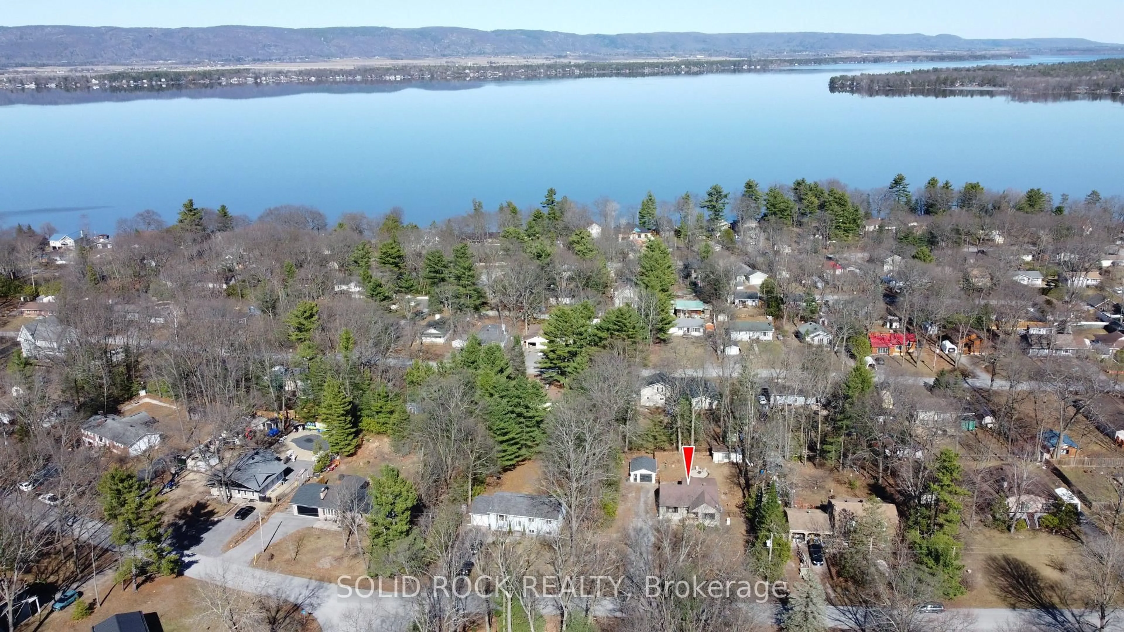 A pic from outside/outdoor area/front of a property/back of a property/a pic from drone, water/lake/river/ocean view for 134 Holiday Dr, Ottawa Ontario K0A 3M0