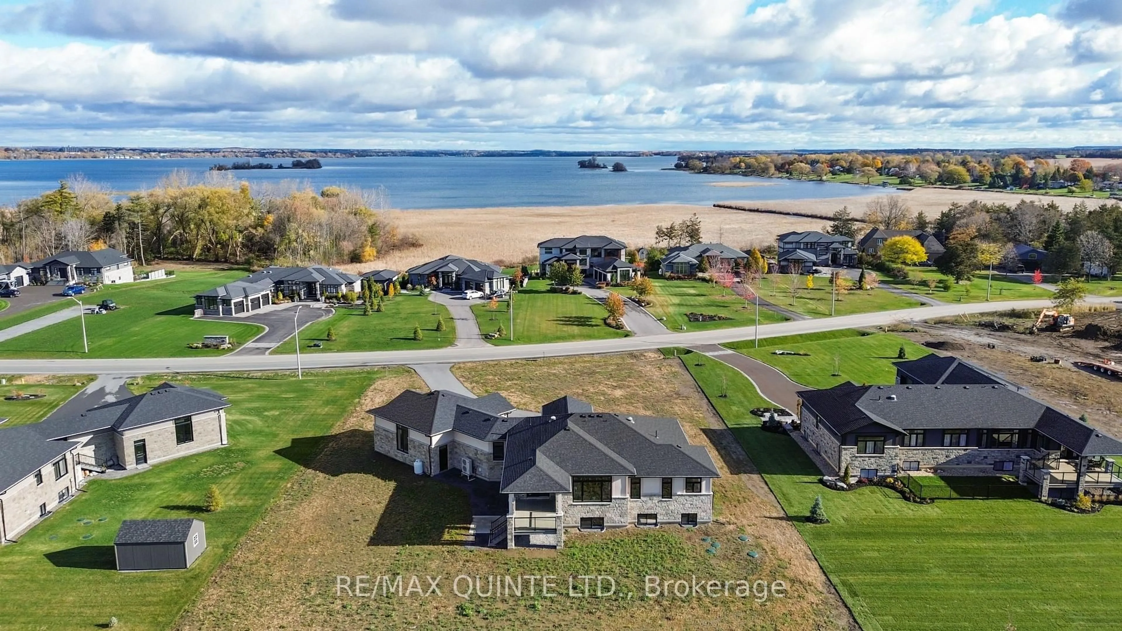 A pic from outside/outdoor area/front of a property/back of a property/a pic from drone, water/lake/river/ocean view for 25 Leaside Dr, Prince Edward County Ontario K8N 4Z7