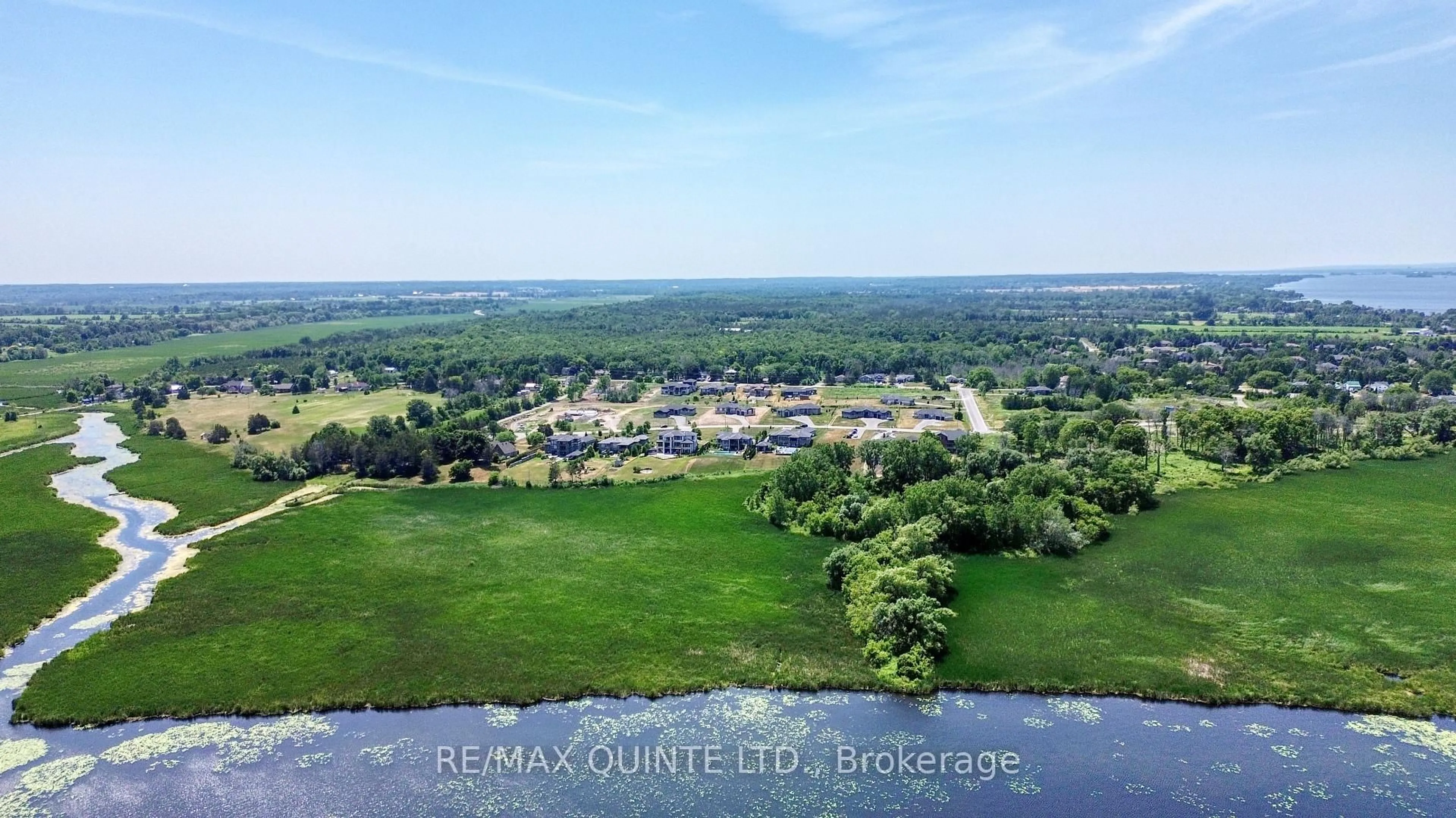 A pic from outside/outdoor area/front of a property/back of a property/a pic from drone, water/lake/river/ocean view for 25 Leaside Dr, Prince Edward County Ontario K8N 4Z7