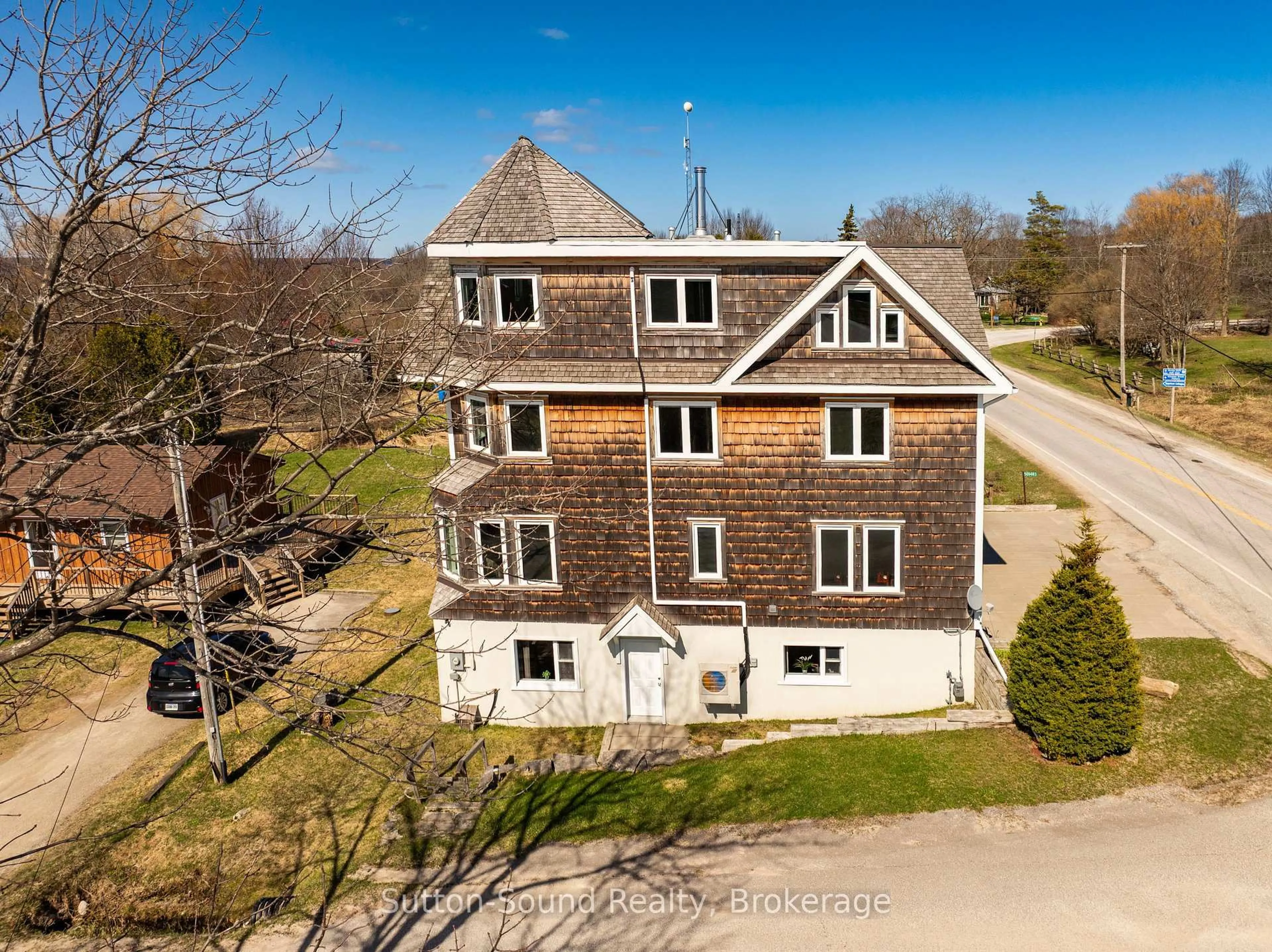 A pic from outside/outdoor area/front of a property/back of a property/a pic from drone, building for 501483 Grey Road 1 Rd, Georgian Bluffs Ontario N0H 2T0
