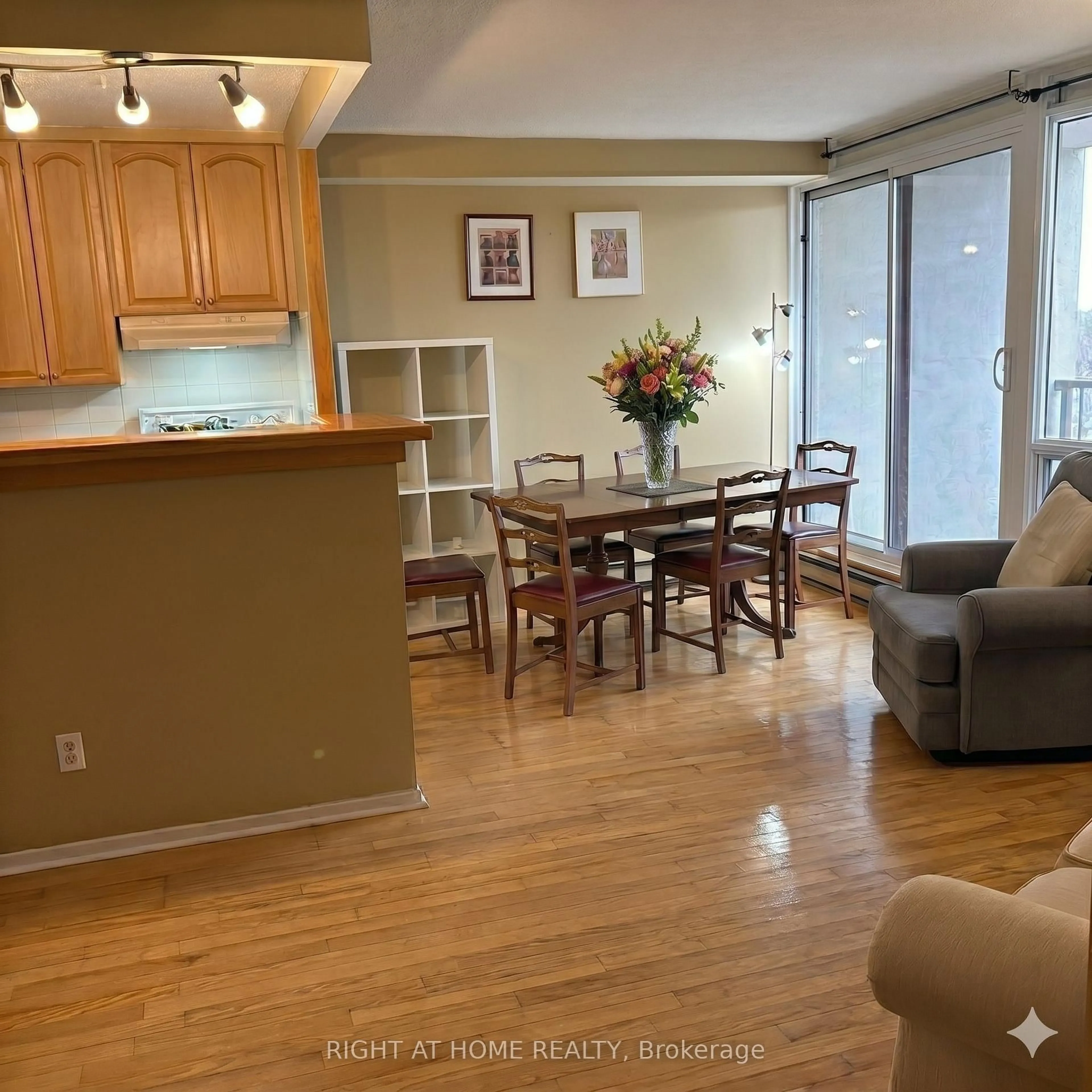 Living room with furniture, wood/laminate floor for 900 Dynes Rd #1708, Ottawa Ontario K2C 3L6