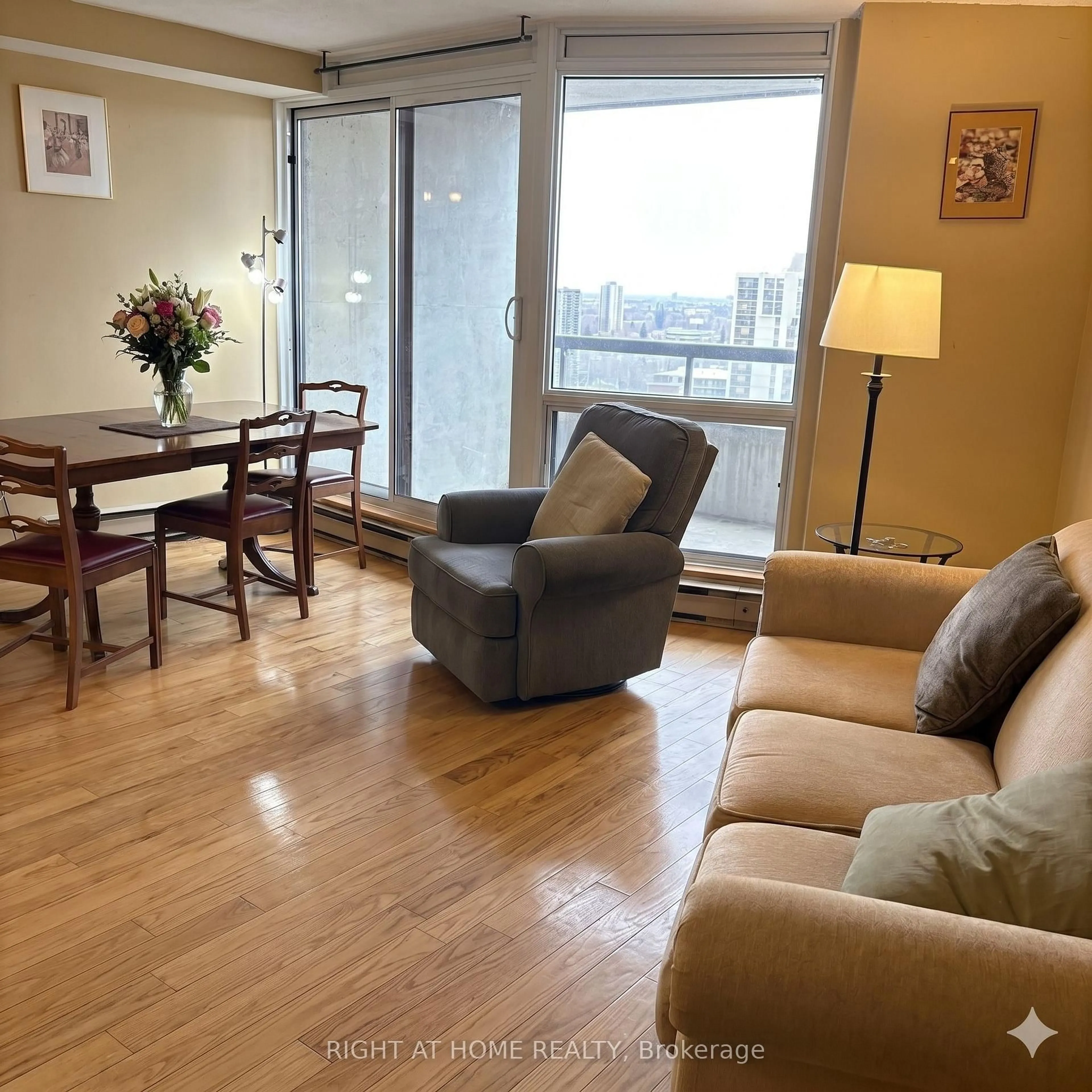 Living room with furniture, wood/laminate floor for 900 Dynes Rd #1708, Ottawa Ontario K2C 3L6