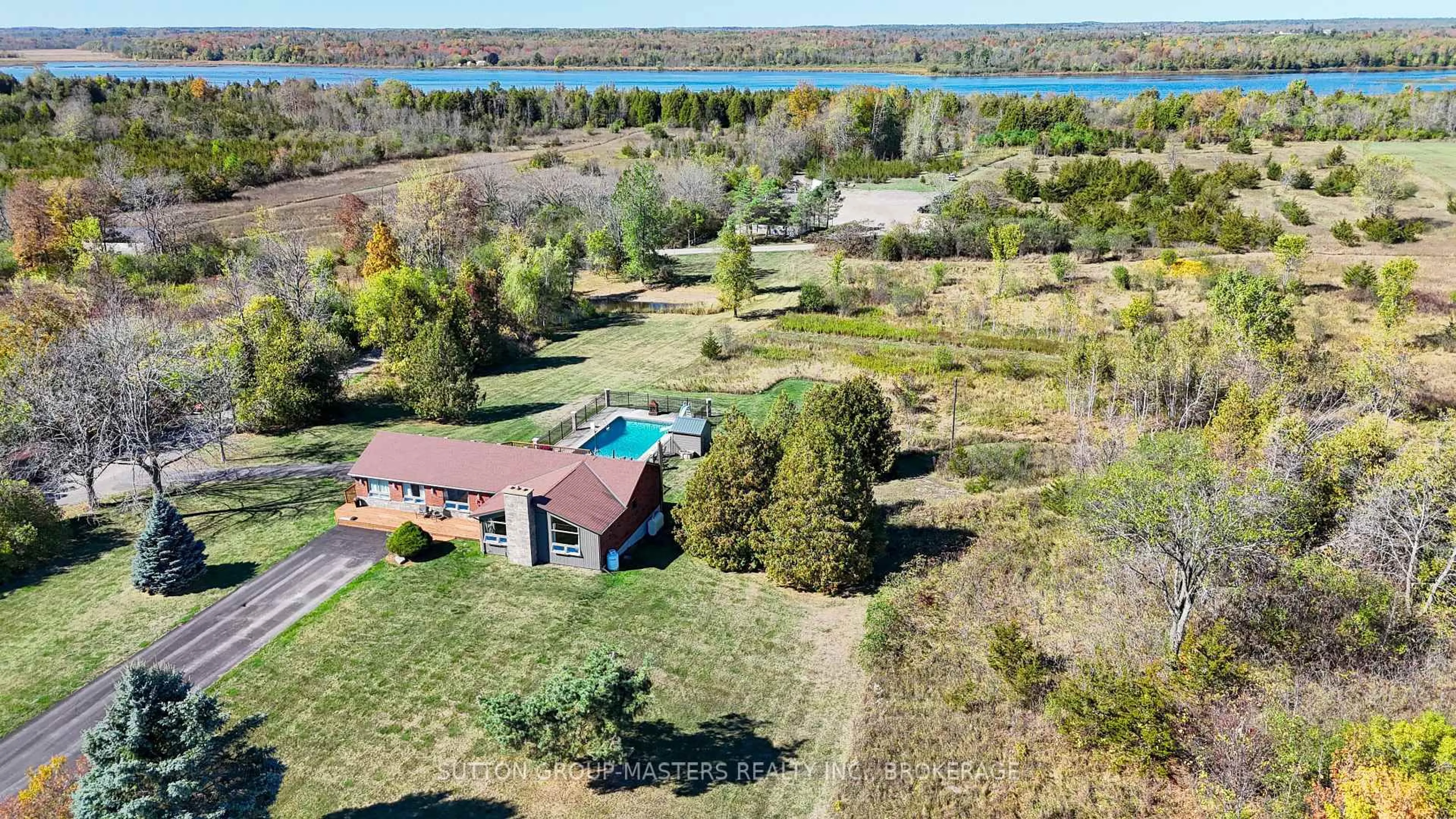 A pic from outside/outdoor area/front of a property/back of a property/a pic from drone, water/lake/river/ocean view for 4404 UNITY Rd, Bissett Creek Ontario K0H 2H0