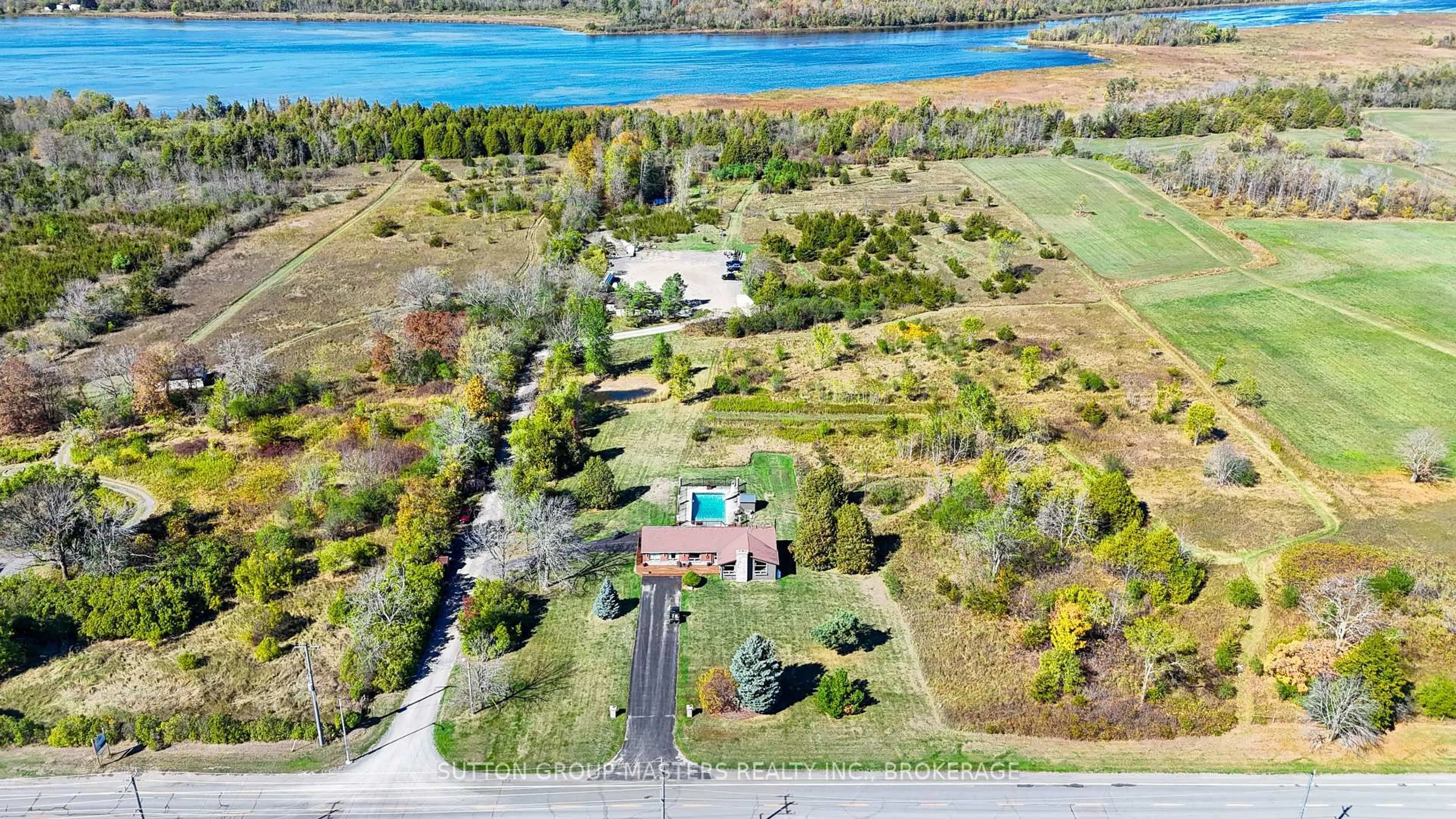 A pic from outside/outdoor area/front of a property/back of a property/a pic from drone, water/lake/river/ocean view for 4404 UNITY Rd, Bissett Creek Ontario K0H 2H0