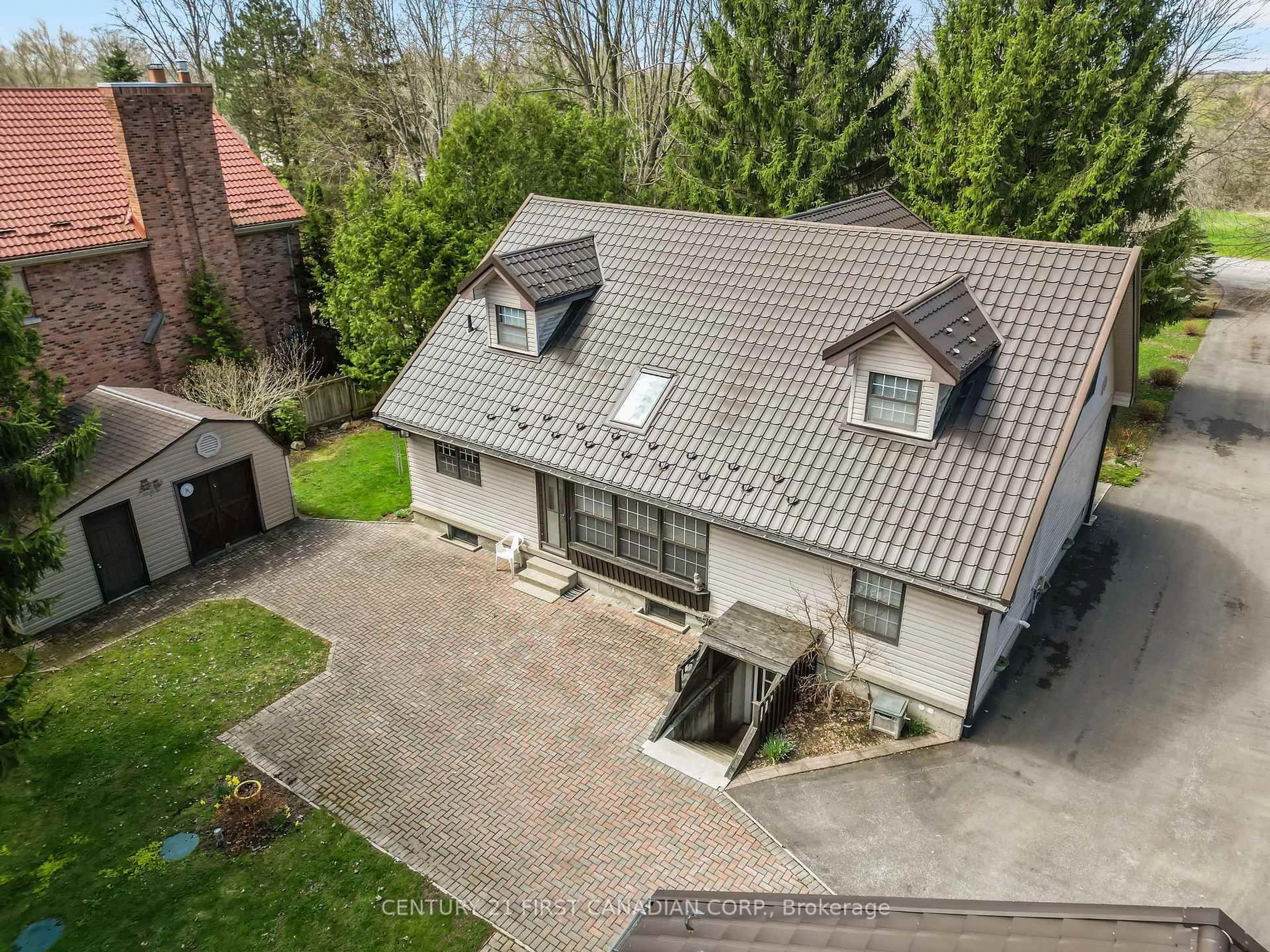 A pic from outside/outdoor area/front of a property/back of a property/a pic from drone, street for 33396 Queen St, North Middlesex Ontario N0M 1A0