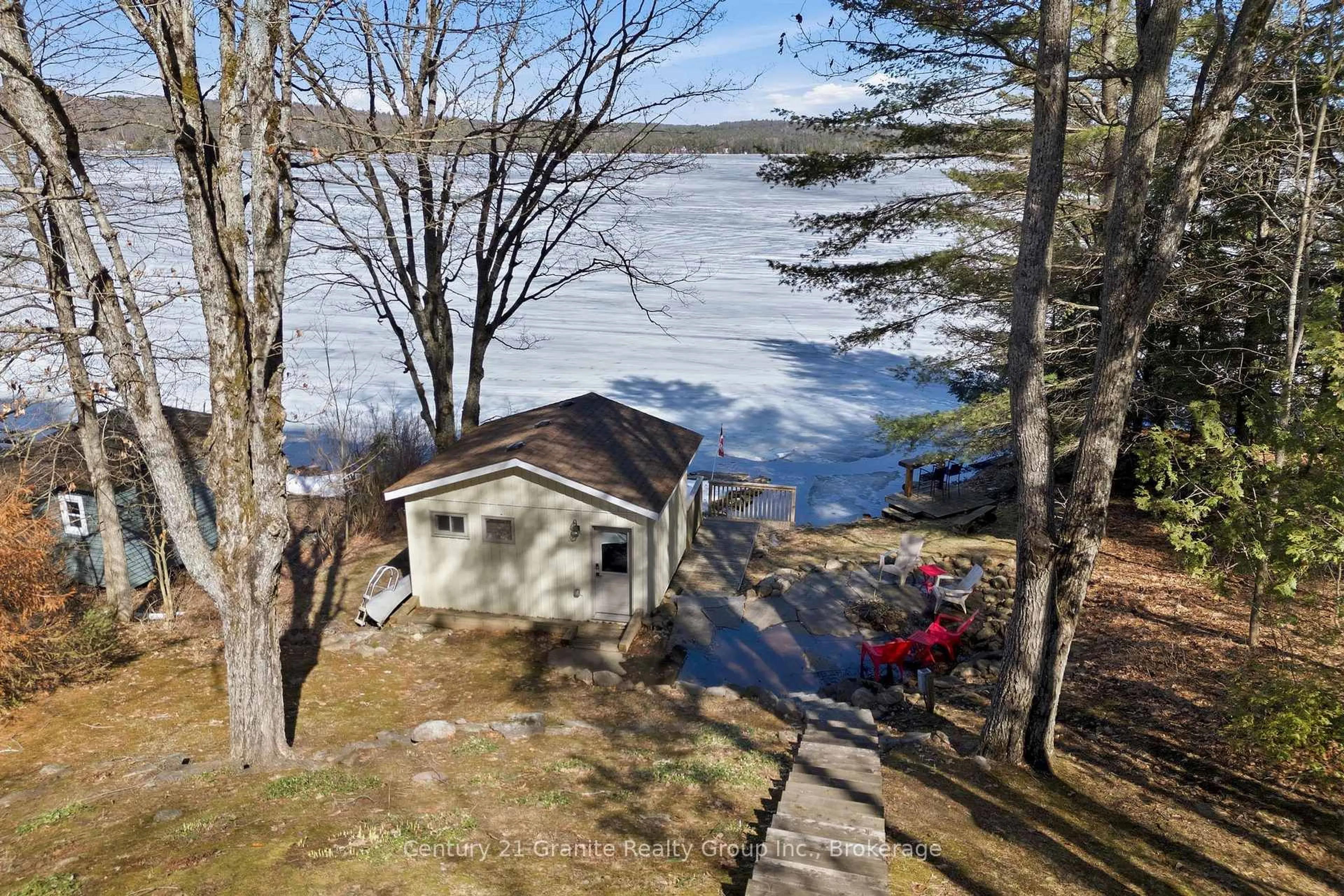 A pic from outside/outdoor area/front of a property/back of a property/a pic from drone, water/lake/river/ocean view for 1035 Harvest Moon Lane, Algonquin Highlands Ontario K0M 1S0