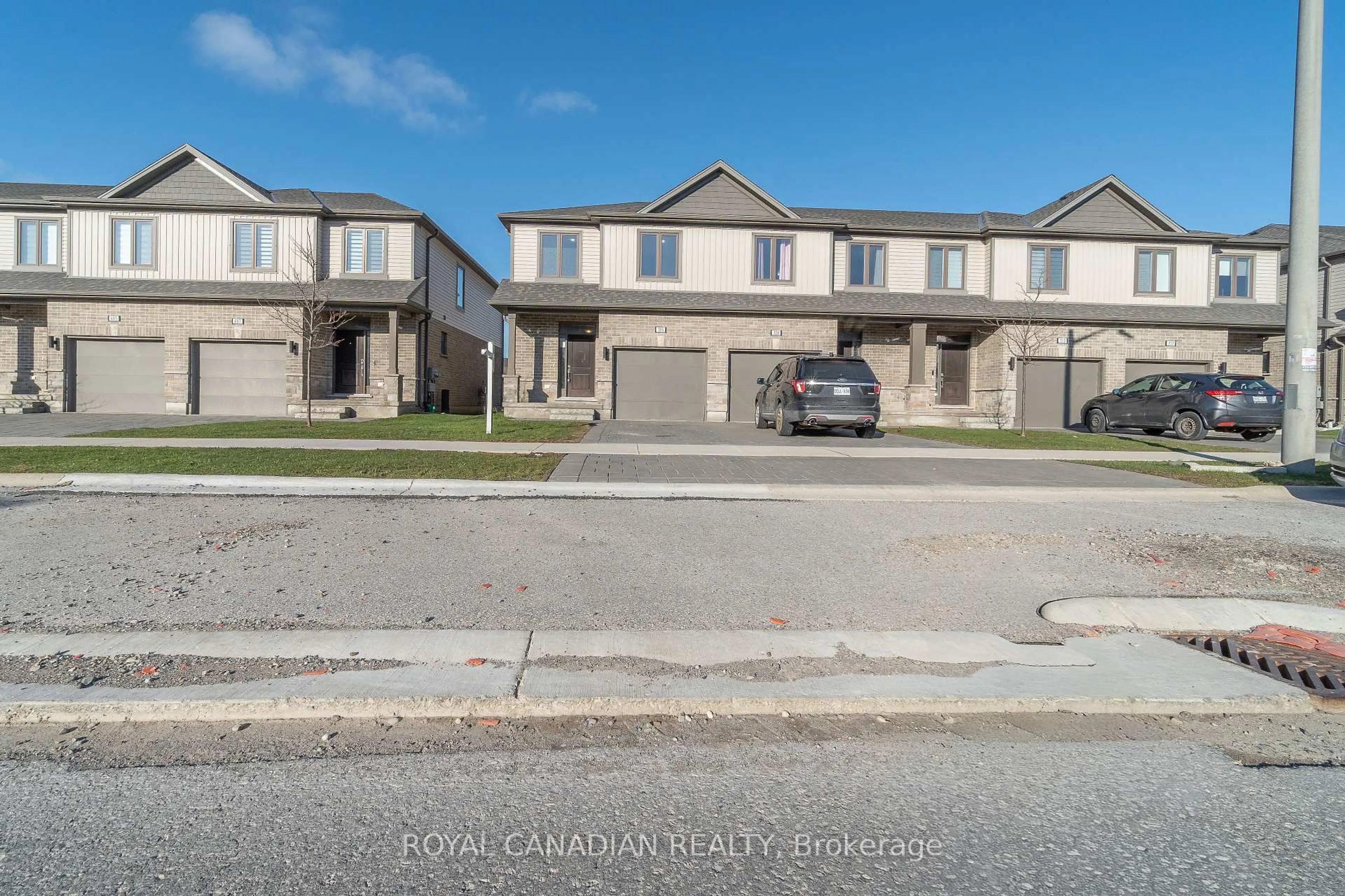 A pic from outside/outdoor area/front of a property/back of a property/a pic from drone, street for 705 Chelton Rd, London South Ontario N6M 0J1