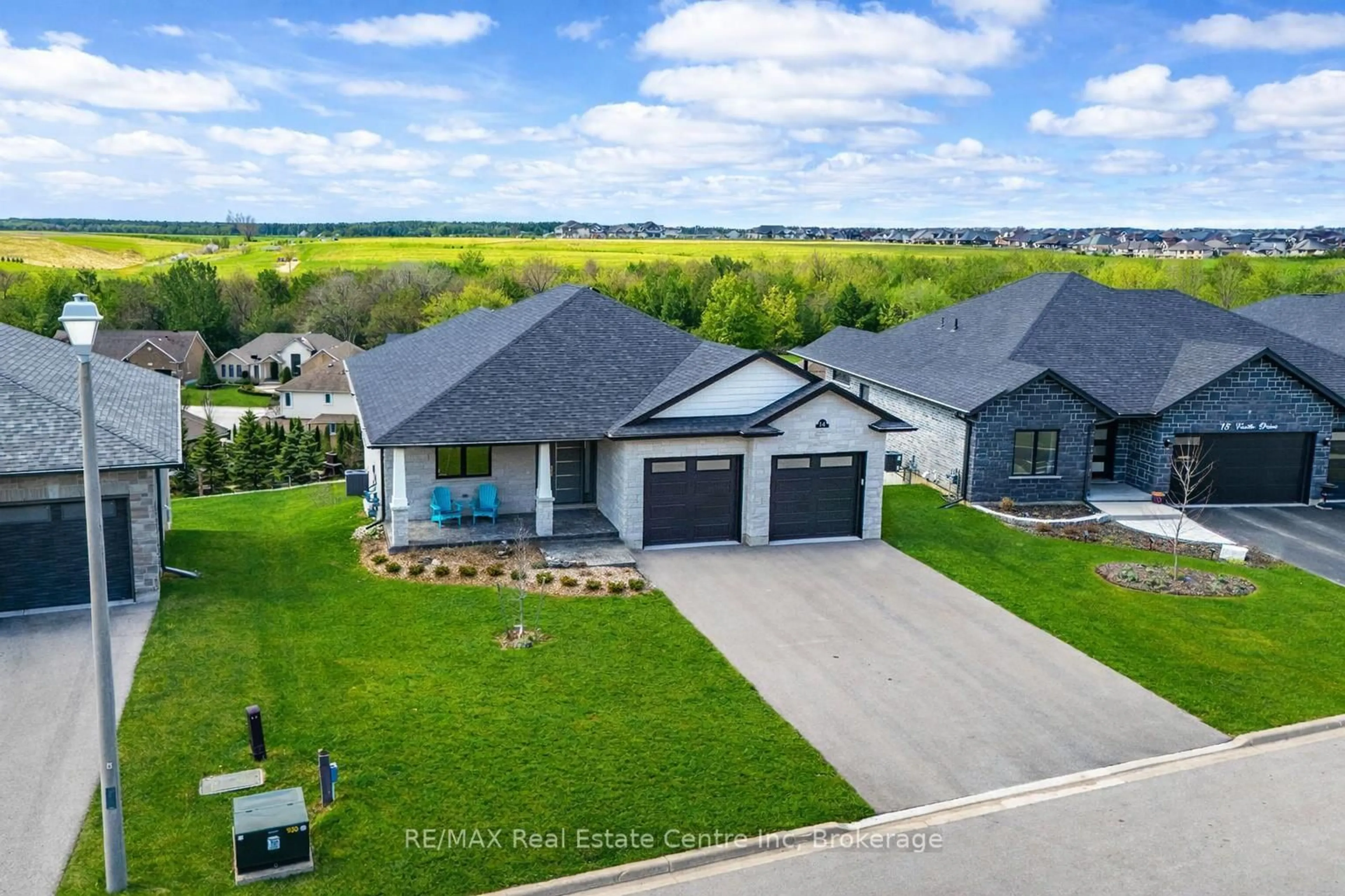 A pic from outside/outdoor area/front of a property/back of a property/a pic from drone, water/lake/river/ocean view for 14 Faith Dr, Mapleton Ontario N0G 1P0
