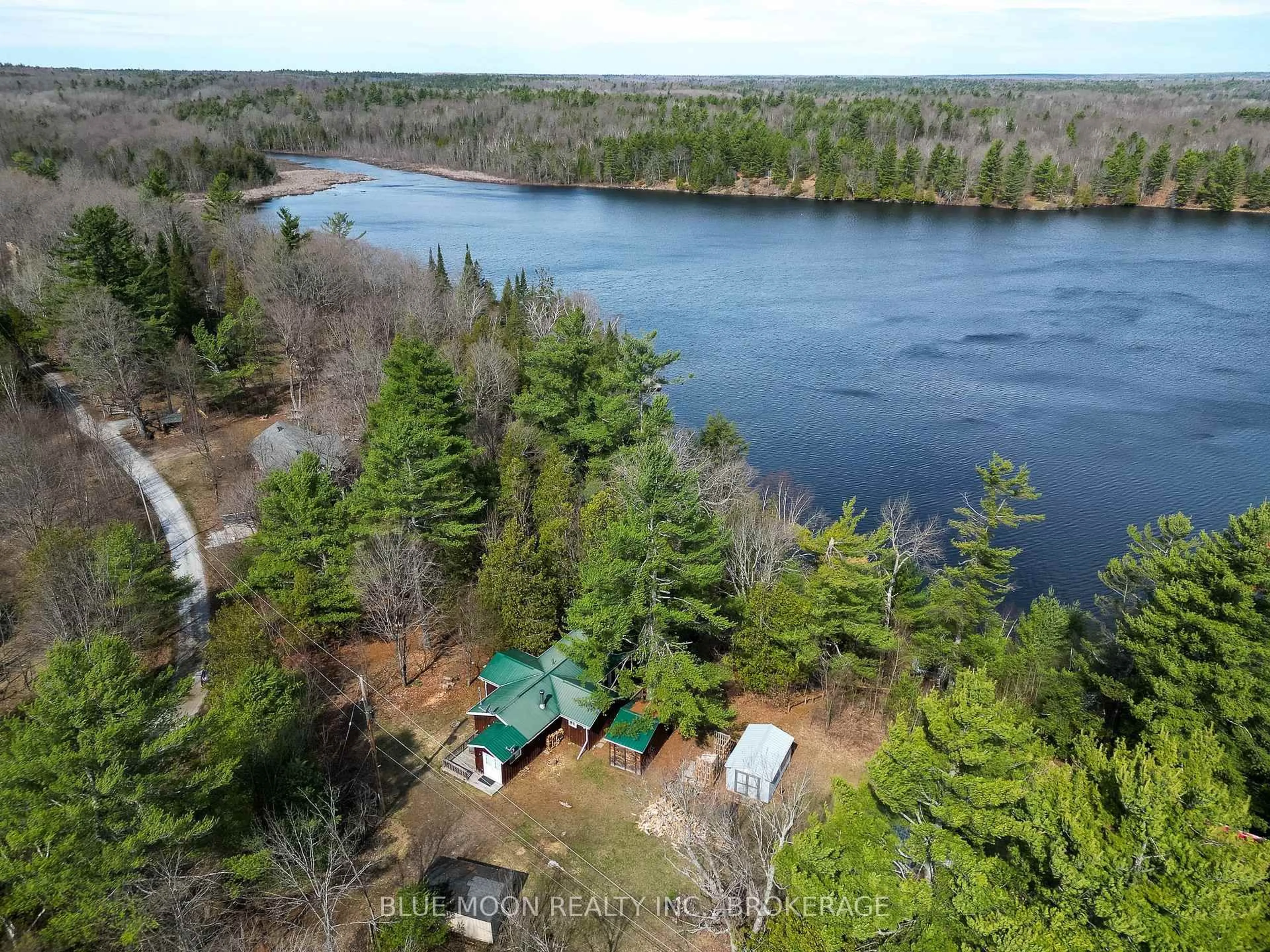 A pic from outside/outdoor area/front of a property/back of a property/a pic from drone, water/lake/river/ocean view for 500 Clear Lake Lane 31A, Maberly Ontario K0H 2B0