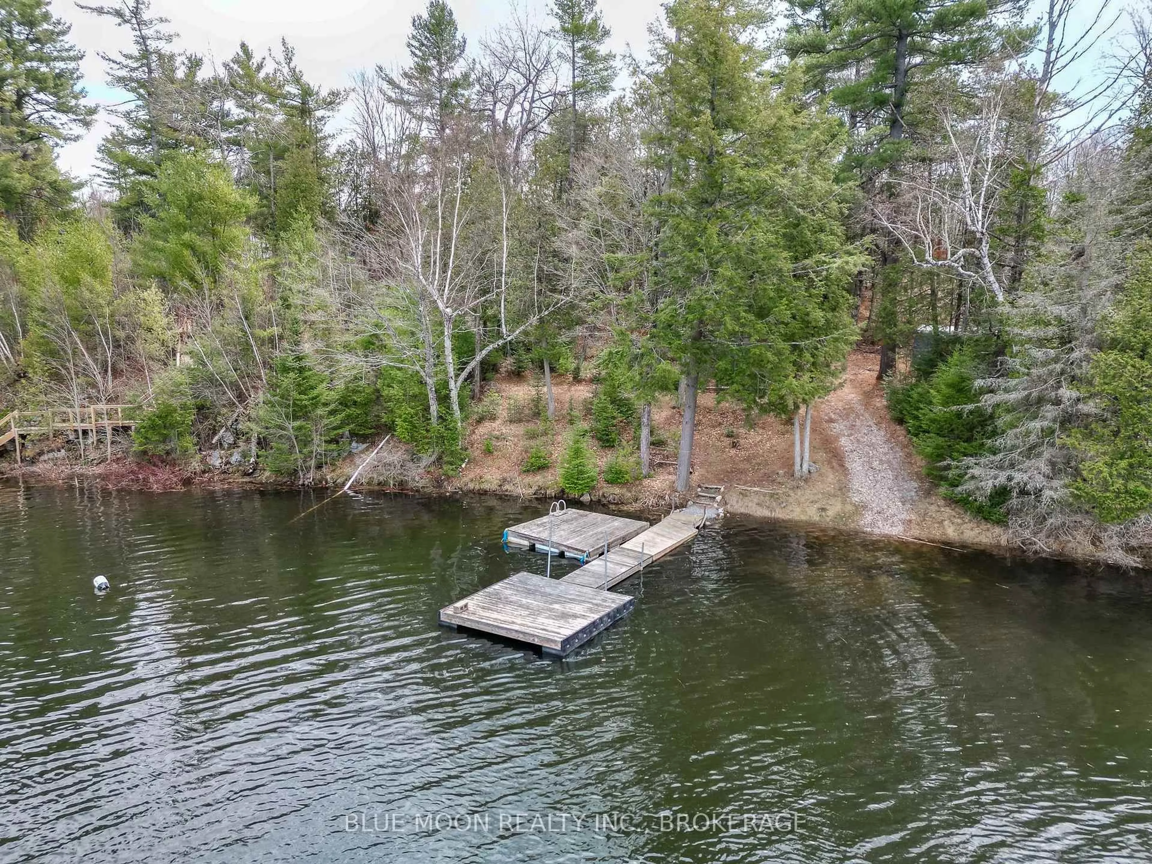 A pic from outside/outdoor area/front of a property/back of a property/a pic from drone, water/lake/river/ocean view for 500 Clear Lake Lane 31A, Maberly Ontario K0H 2B0