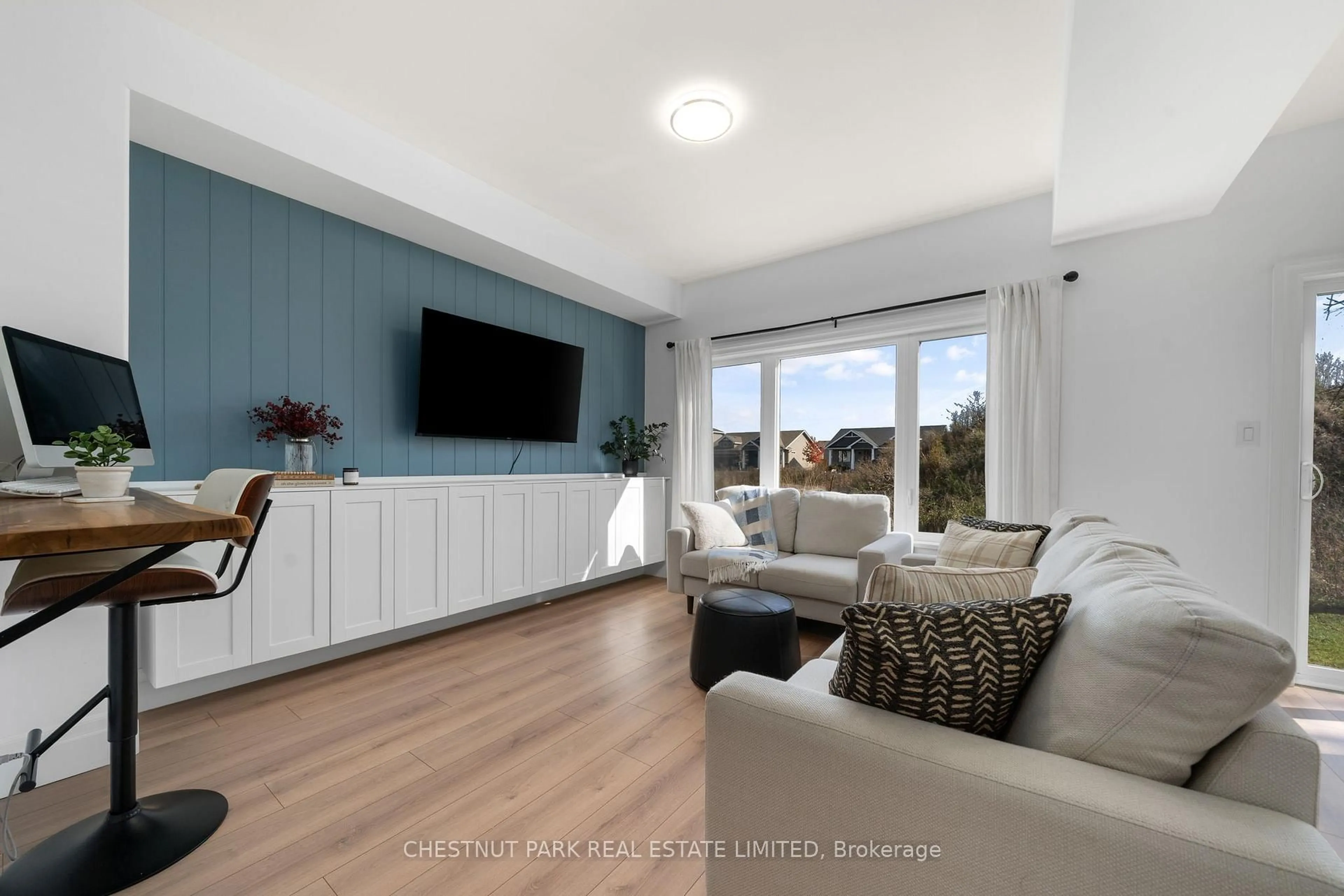 Living room with furniture, wood/laminate floor for 36 Campbell Cres, Prince Edward County Ontario K0K 2T0