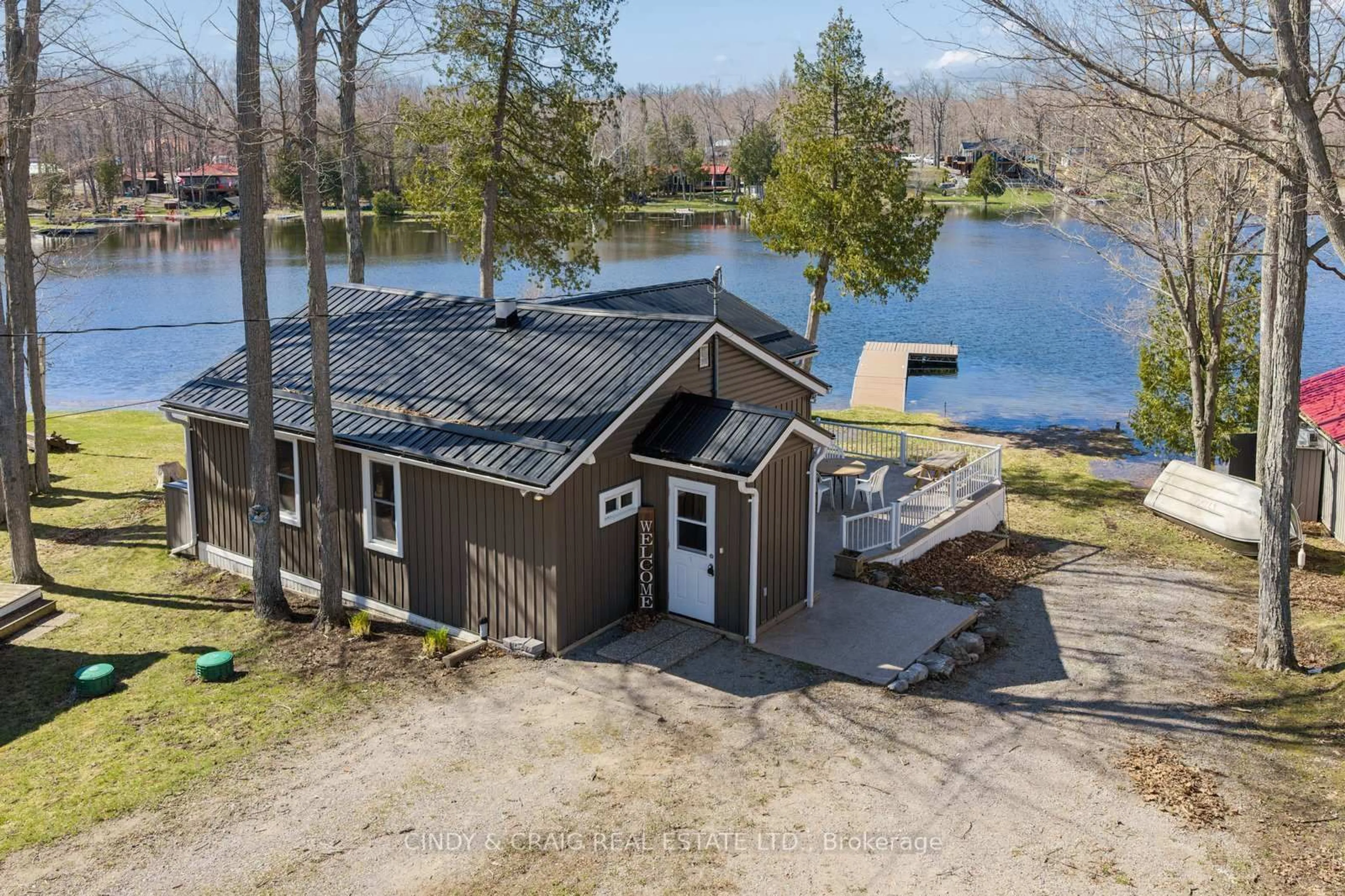 A pic from outside/outdoor area/front of a property/back of a property/a pic from drone, water/lake/river/ocean view for 213 Rollies Point Rd, Selwyn Ontario K0L 1R0