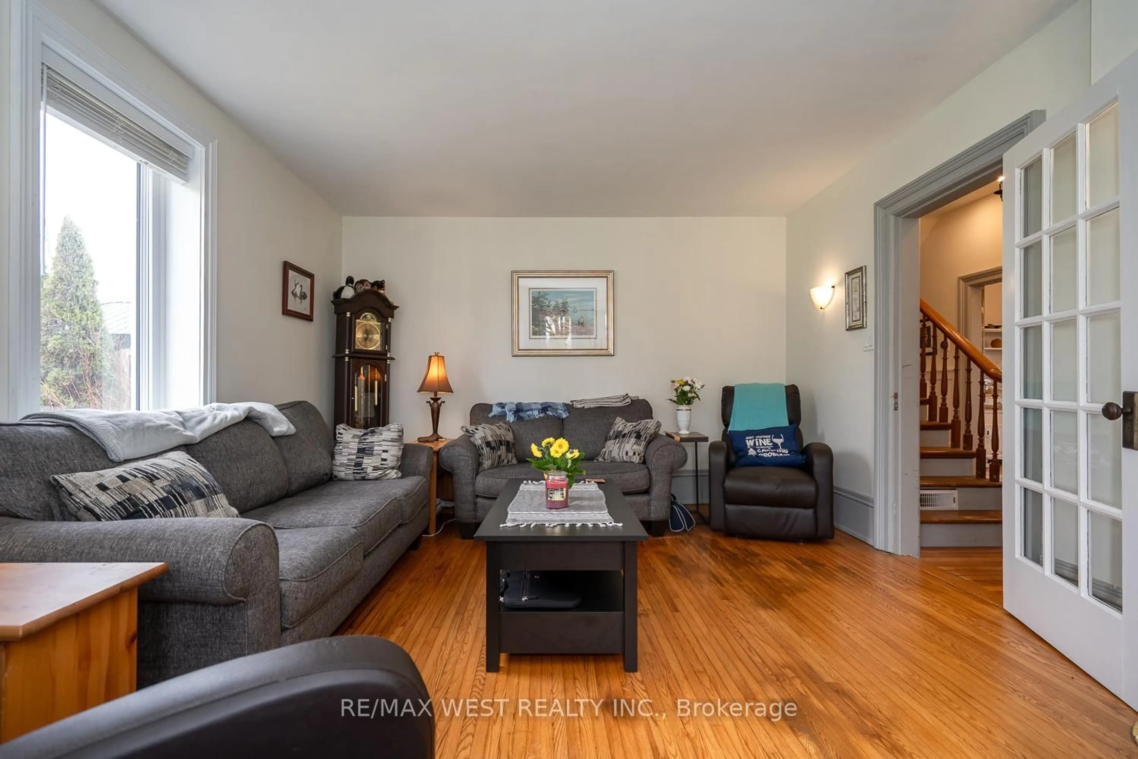 Living room with furniture, wood/laminate floor for 518079 County Road 124, Melancthon Ontario L0N 1S7