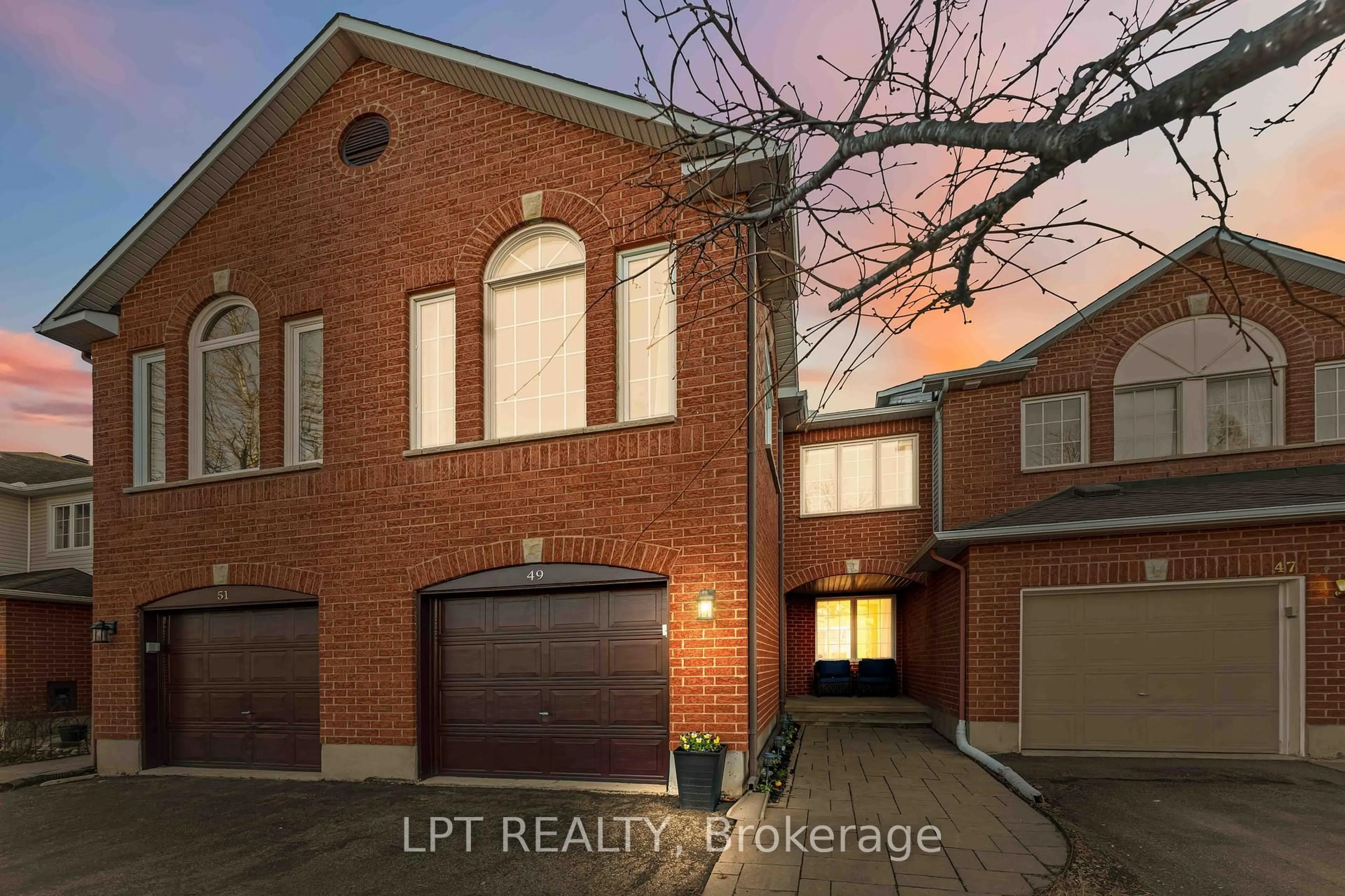 Home with brick exterior material, street for 49 Pennard Way, Ottawa Ontario K1T 4C1