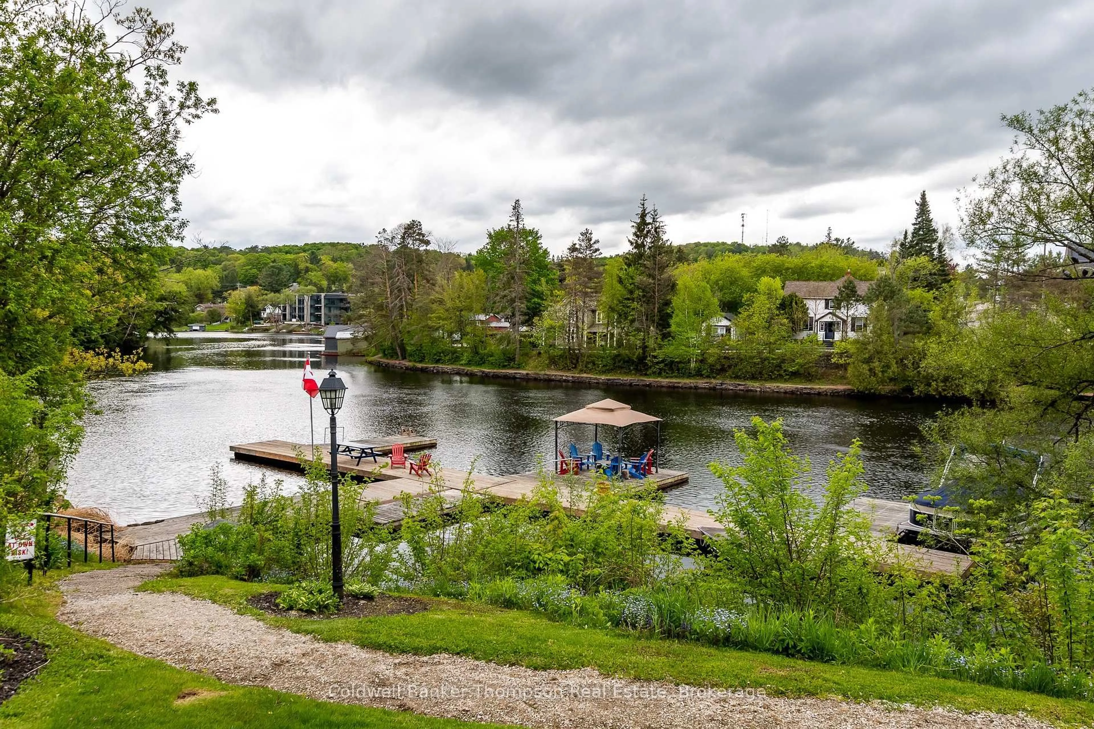 A pic from outside/outdoor area/front of a property/back of a property/a pic from drone, water/lake/river/ocean view for 5 Church St #104, Huntsville Ontario P1H 1G9