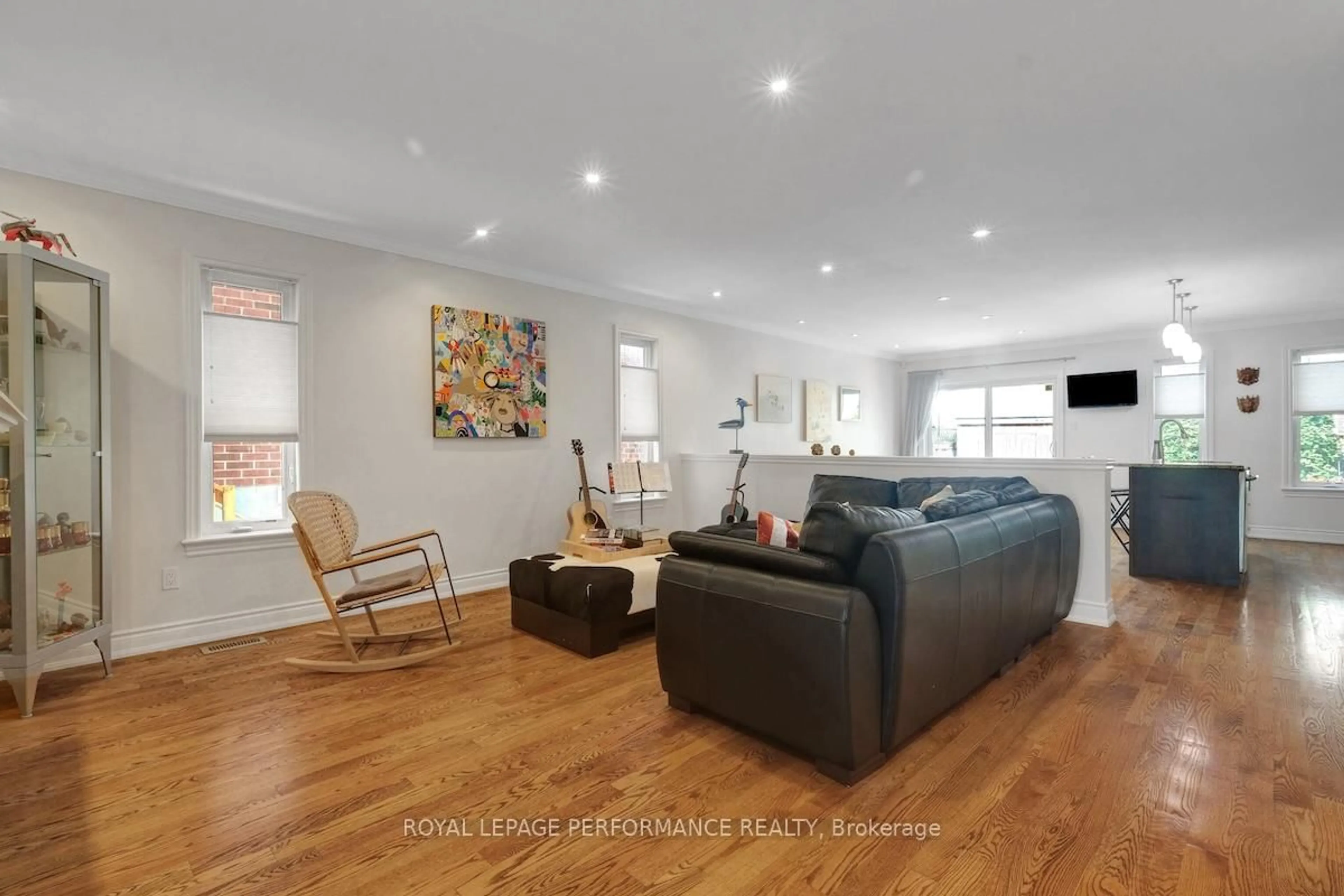 Living room with furniture, wood/laminate floor for 257 Currell Ave, Ottawa Ontario K1Z 7J5