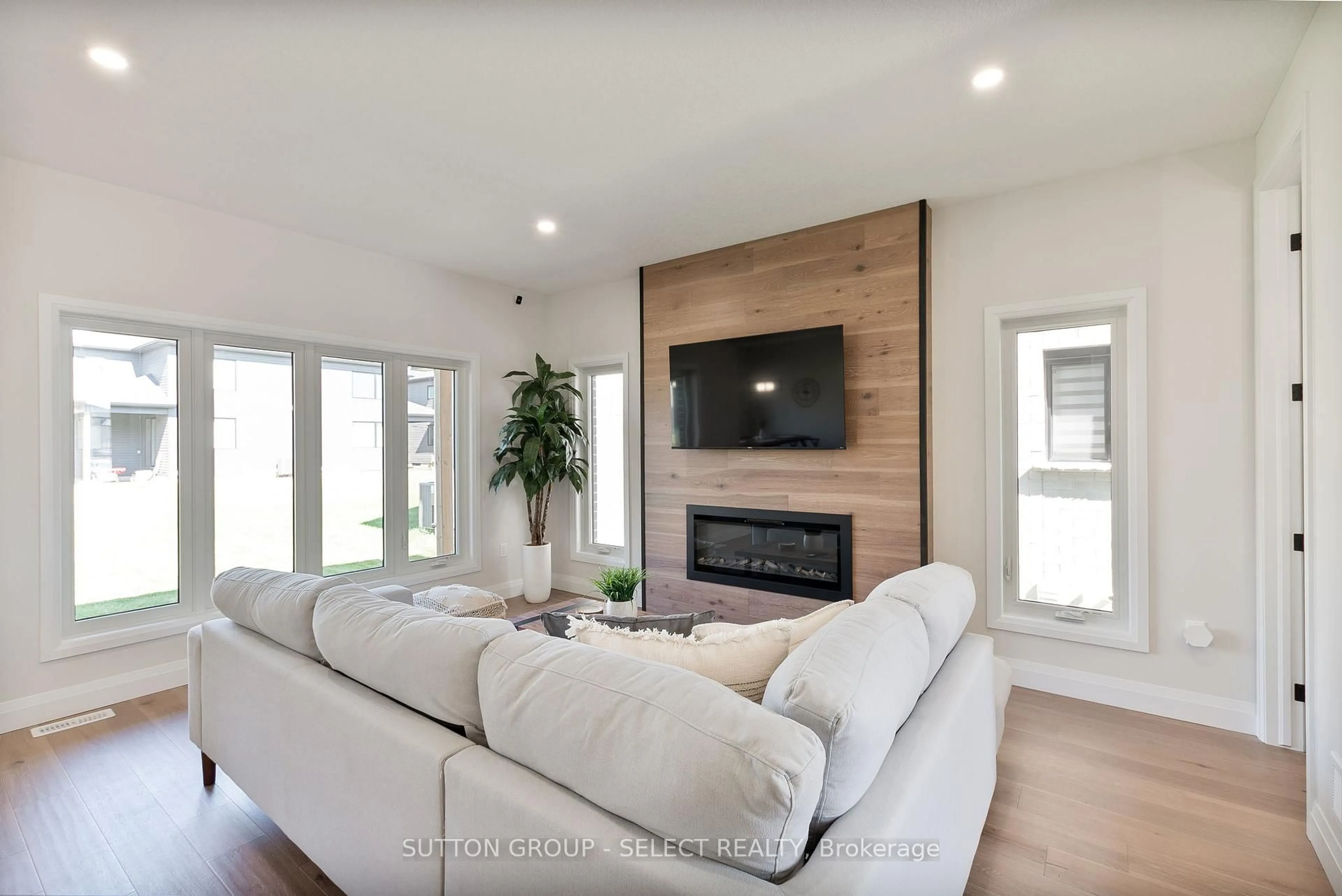 Living room with furniture, wood/laminate floor for 6366 Heathwoods Ave, London South Ontario N6P 1H5