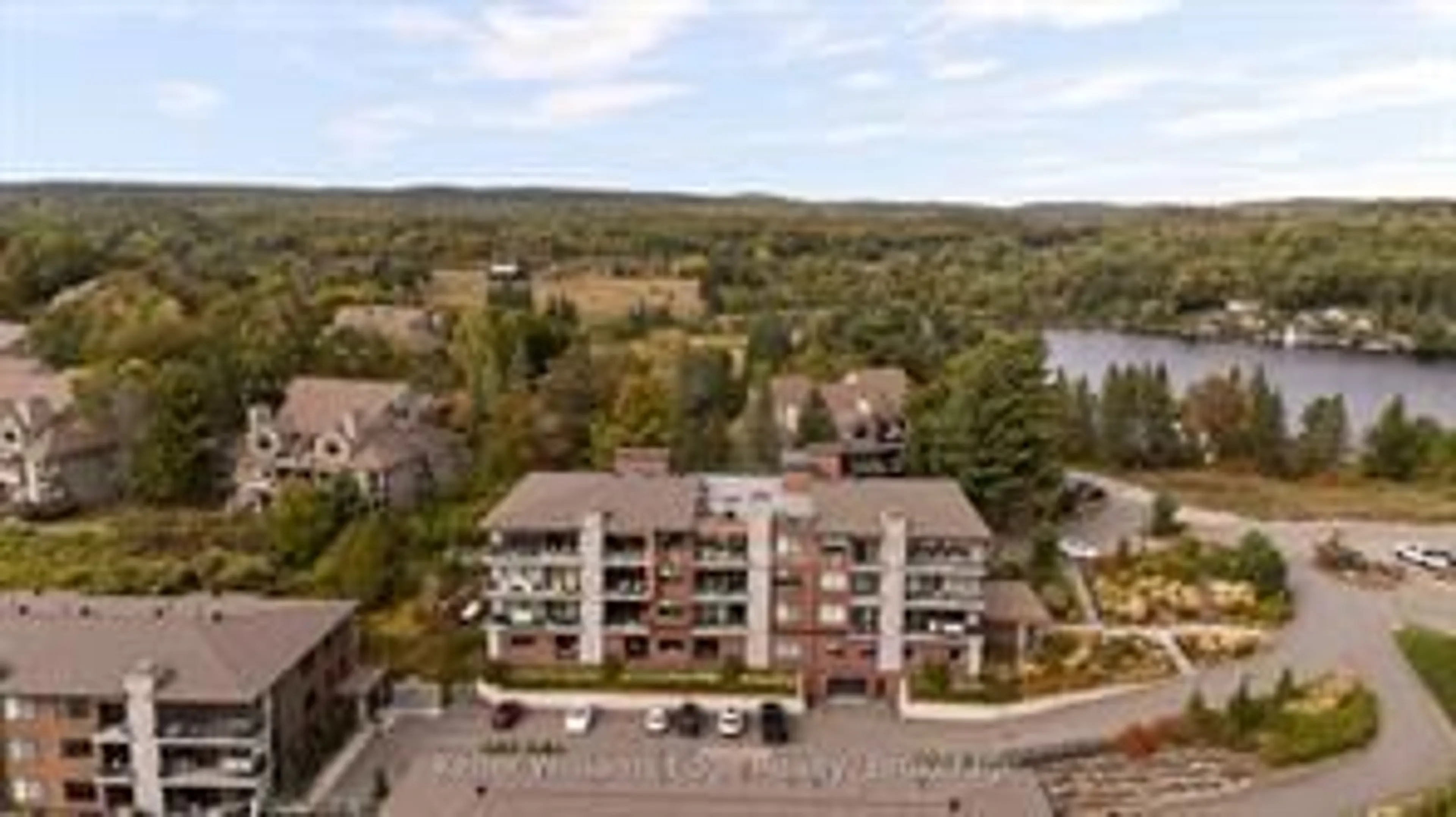 A pic from outside/outdoor area/front of a property/back of a property/a pic from drone, water/lake/river/ocean view for 727 Grandview Dr #209, Huntsville Ontario P1H 2J5