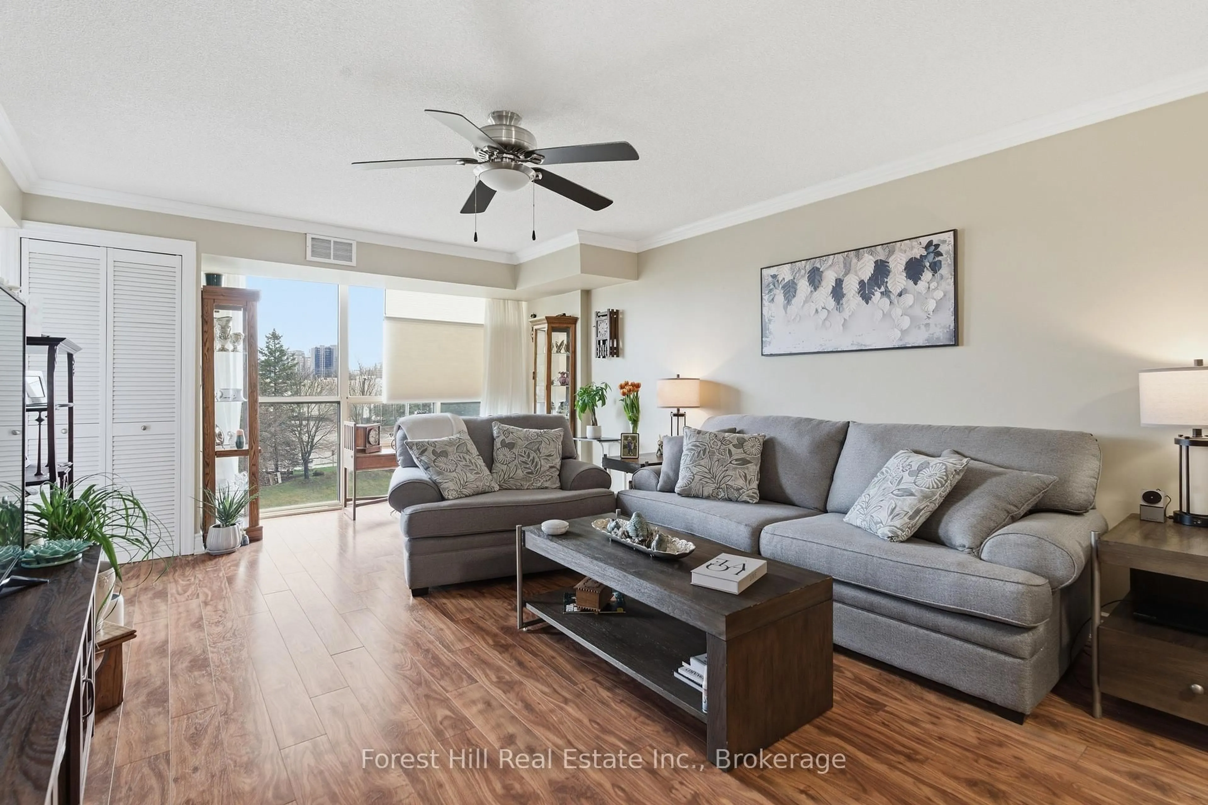 Living room with furniture, wood/laminate floor for 55 Blue Springs Dr #402, Waterloo Ontario N2J 4T3