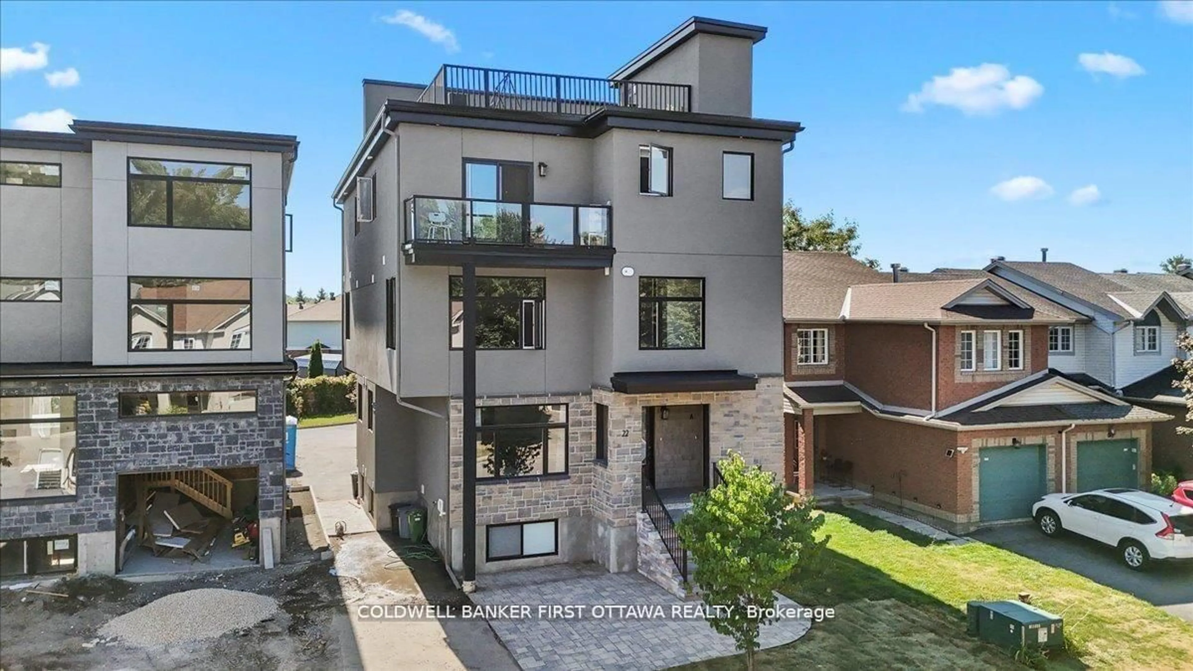 Home with brick exterior material, street for 25 Pennard Way #A & B, Ottawa Ontario K1T 4C1