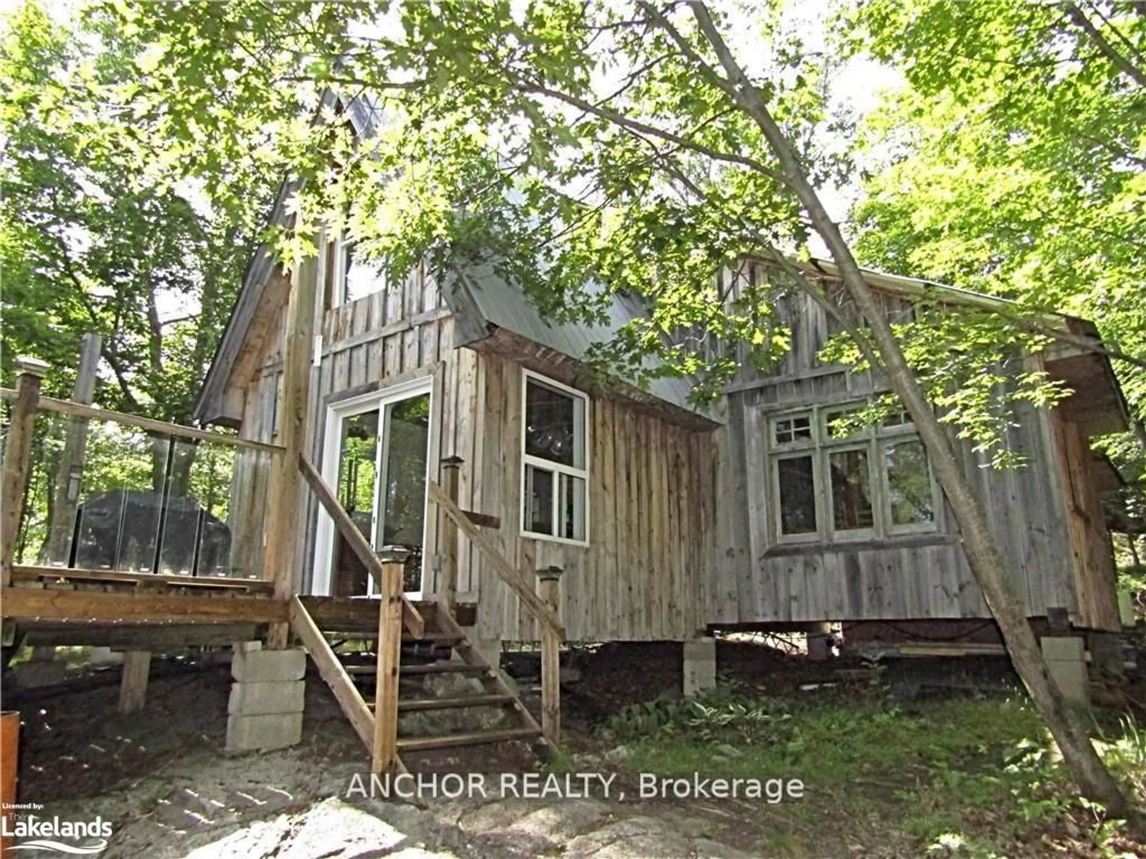 A pic from outside/outdoor area/front of a property/back of a property/a pic from drone, unknown for 550 Shawanaga Lake, McDougall Ontario P0A 1G0