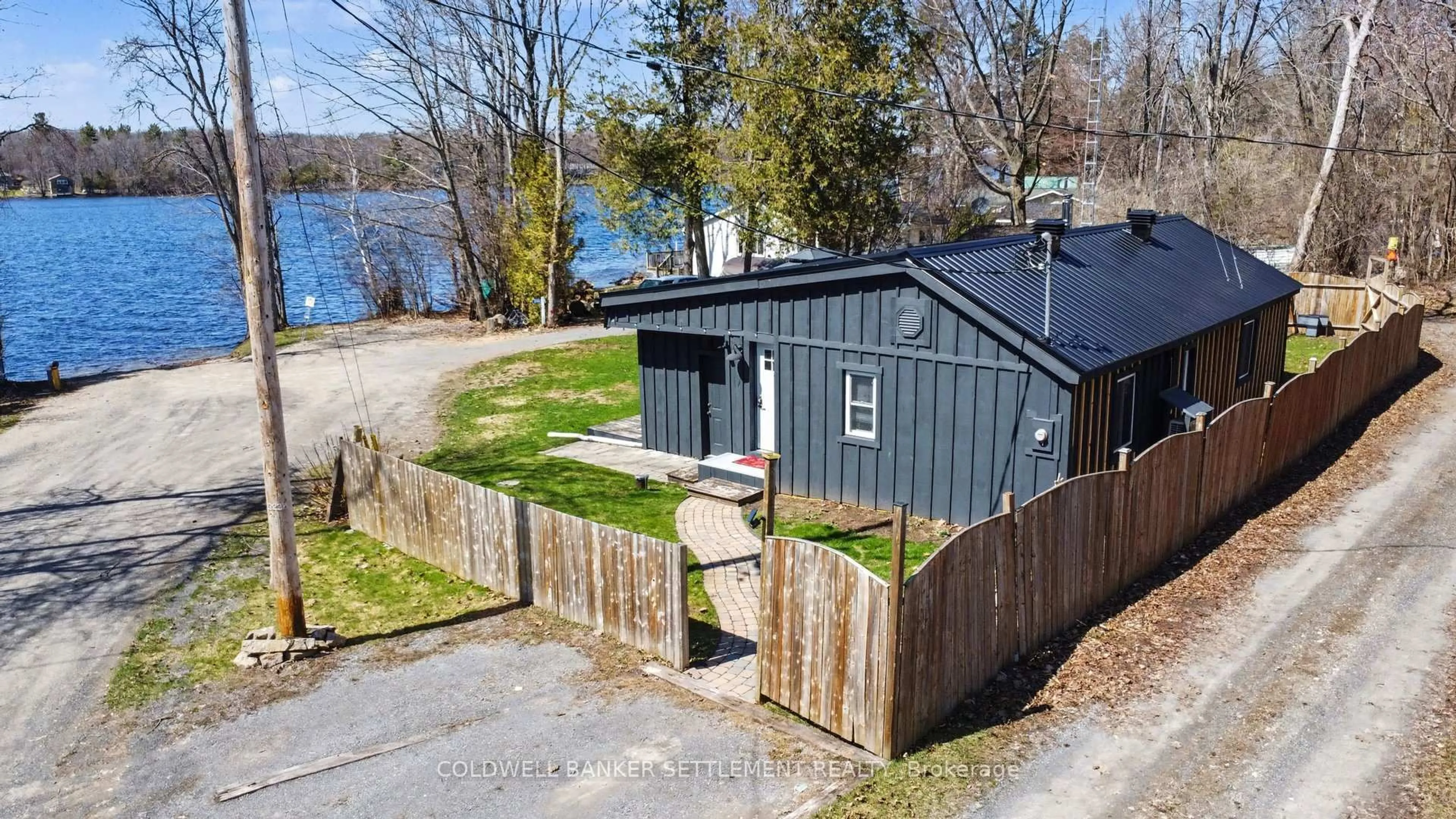 A pic from outside/outdoor area/front of a property/back of a property/a pic from drone, water/lake/river/ocean view for 128 Loon Lane, Beckwith Ontario K7C 4L8